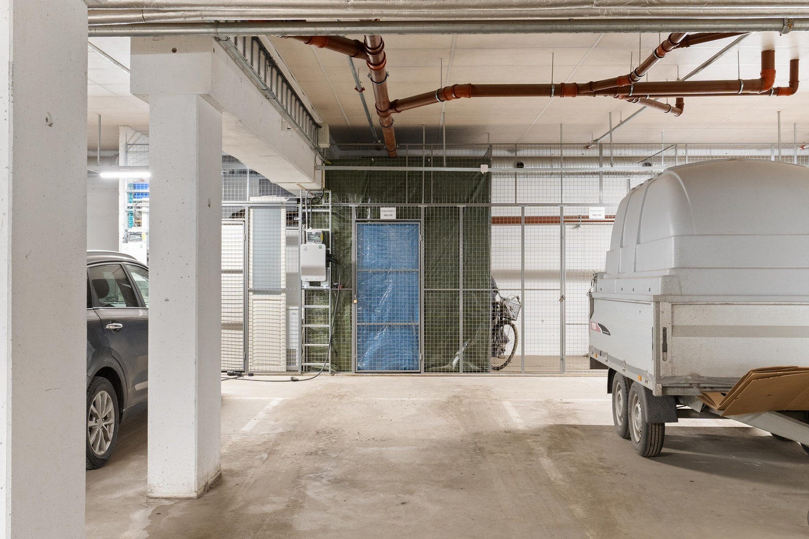 Boligen disponerer bruken av en parkeringsplass med el-lader i felles garasjeanlegg med heisadkomst. Galleribilde