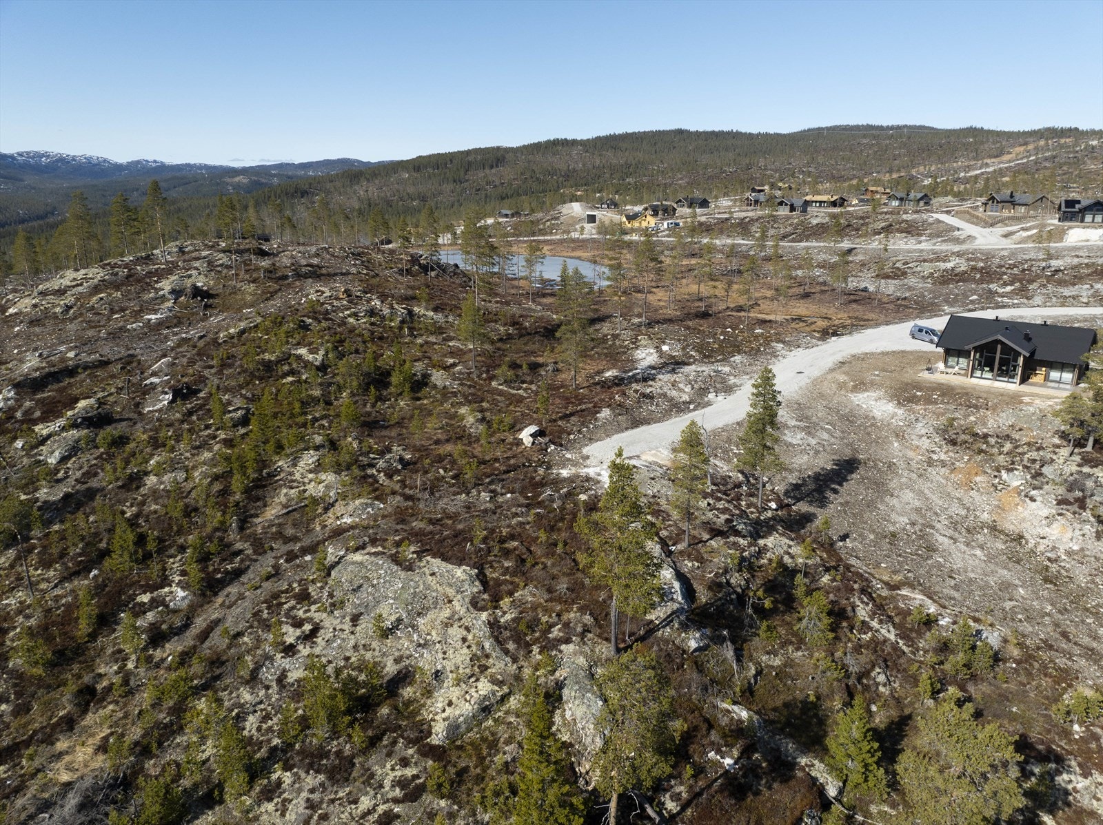 Her vil du aldri få en hytte forran, bare bak Galleribilde