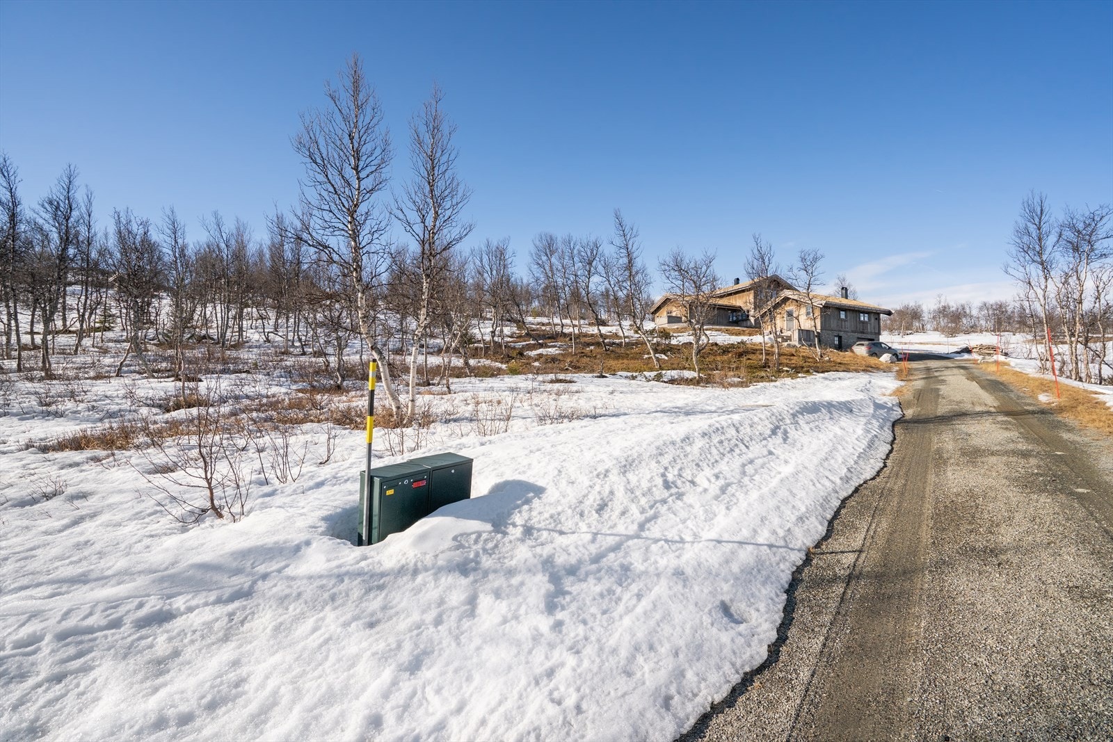 Tomten ligger i lett skrånende terreng. Galleribilde
