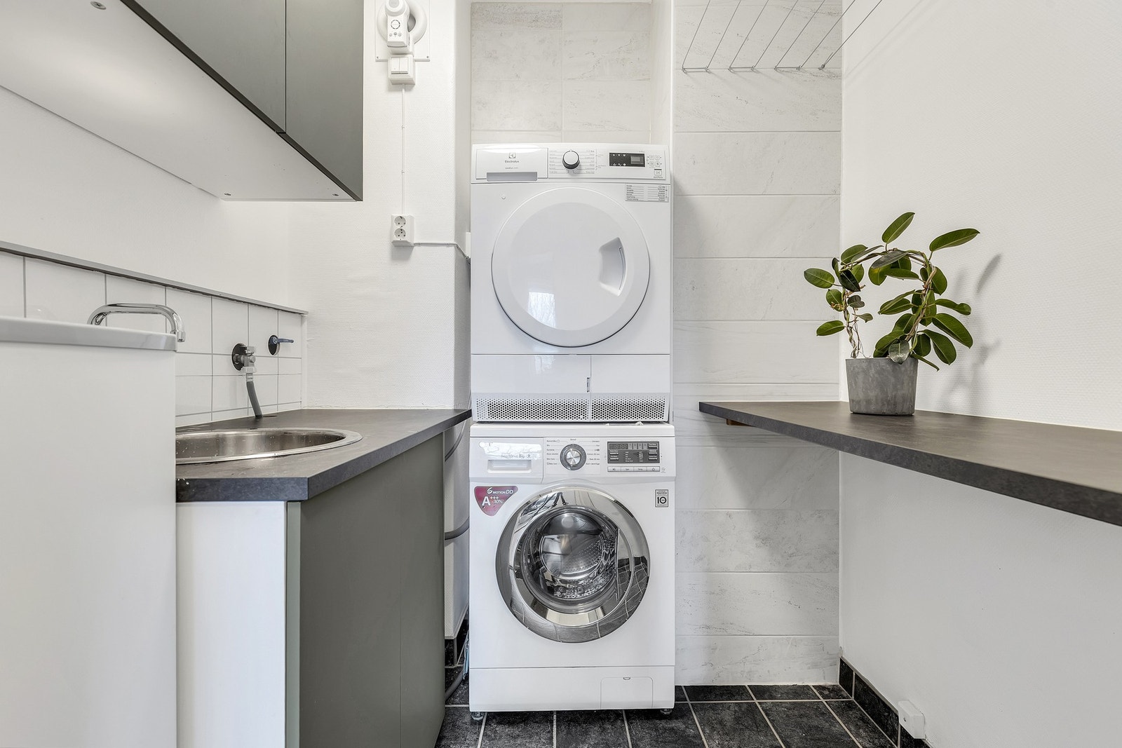 Leiligheten har også et praktisk, separat vaskerom. Galleribilde