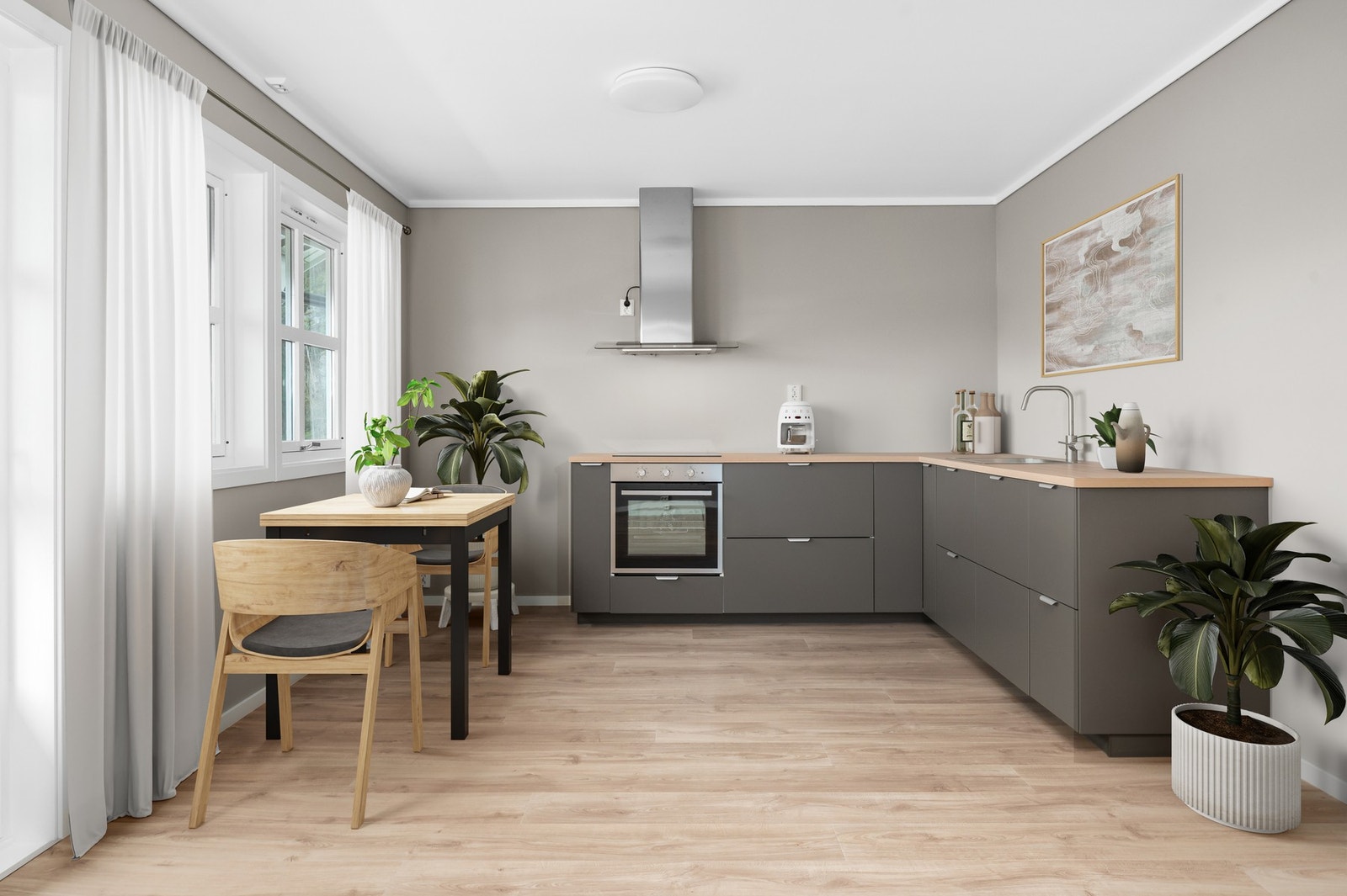 Stilren og moderne kjøkkeninnredning med glatte fronter og benkeplate av laminat. Galleribilde