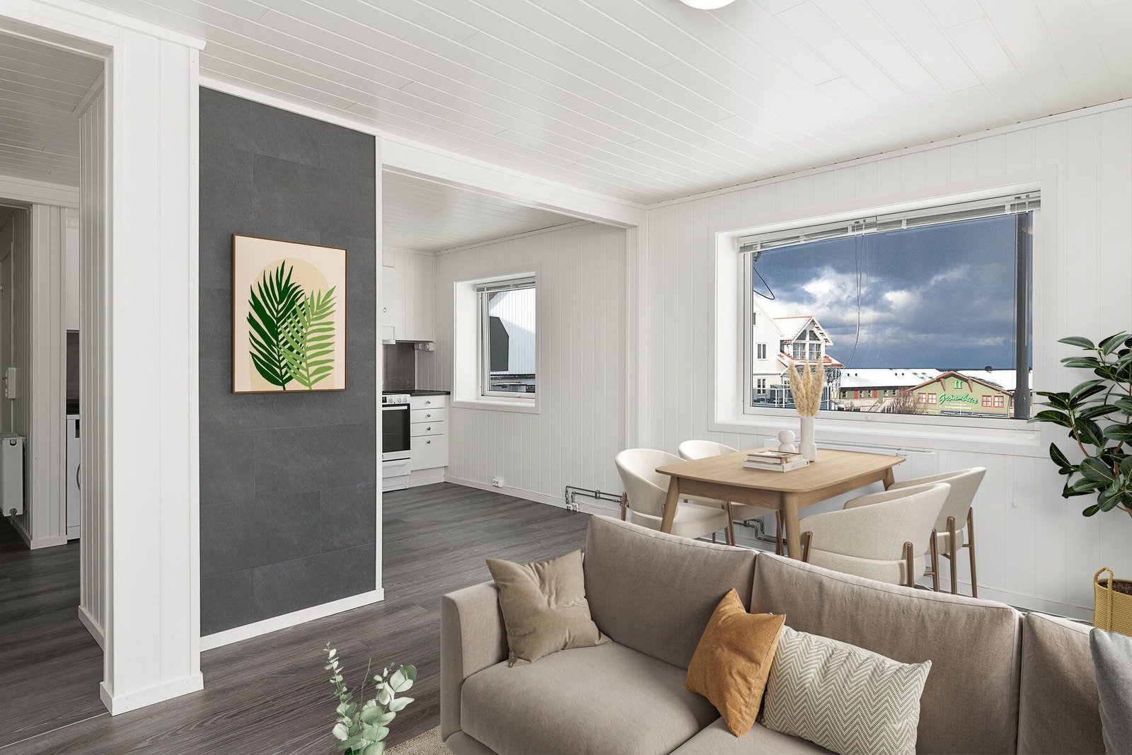 Gangen leder videre inn til stue og kjøkken som er i åpen løsning. Bildet er digitalt stylet. Galleribilde