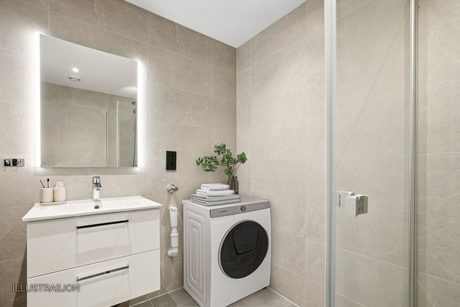 Badet i 2. etasjen er lekkert innredet med moderne fliser med gulvvarme. Baderommet er utstyrt med servant i skuffeseksjon, toalett, dusjløsning og opplegg for vaskemaskin. Galleribilde