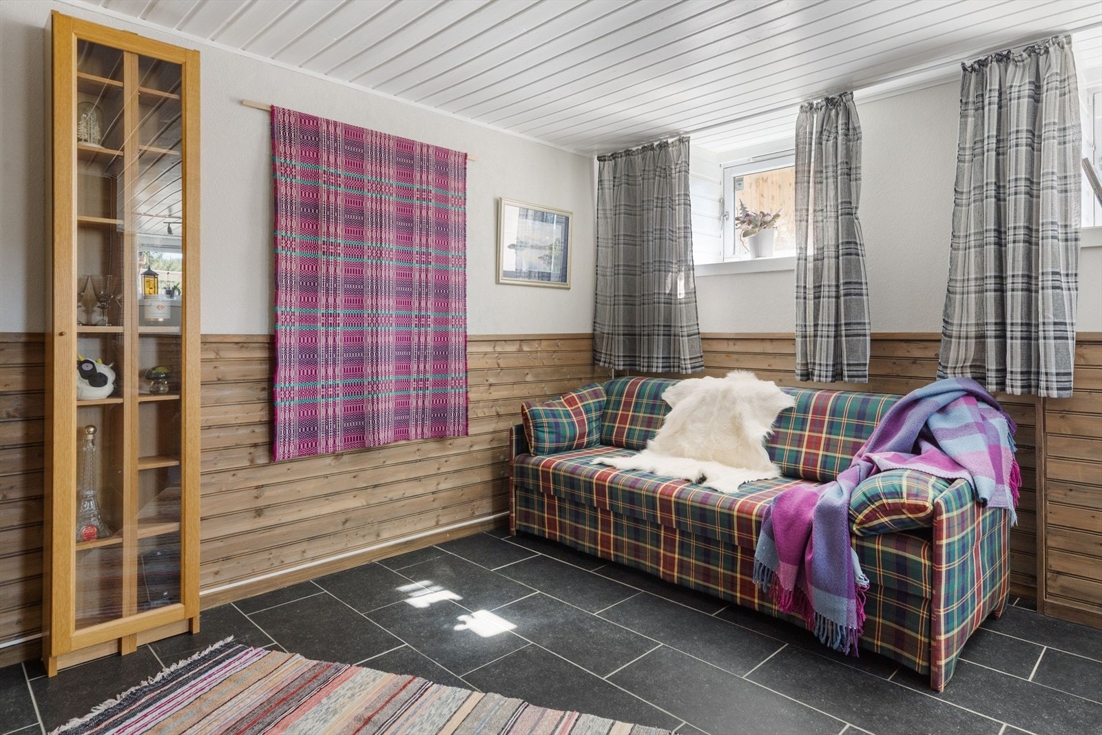 I kjelleren er det en koselig stue på ca. 18m². Galleribilde