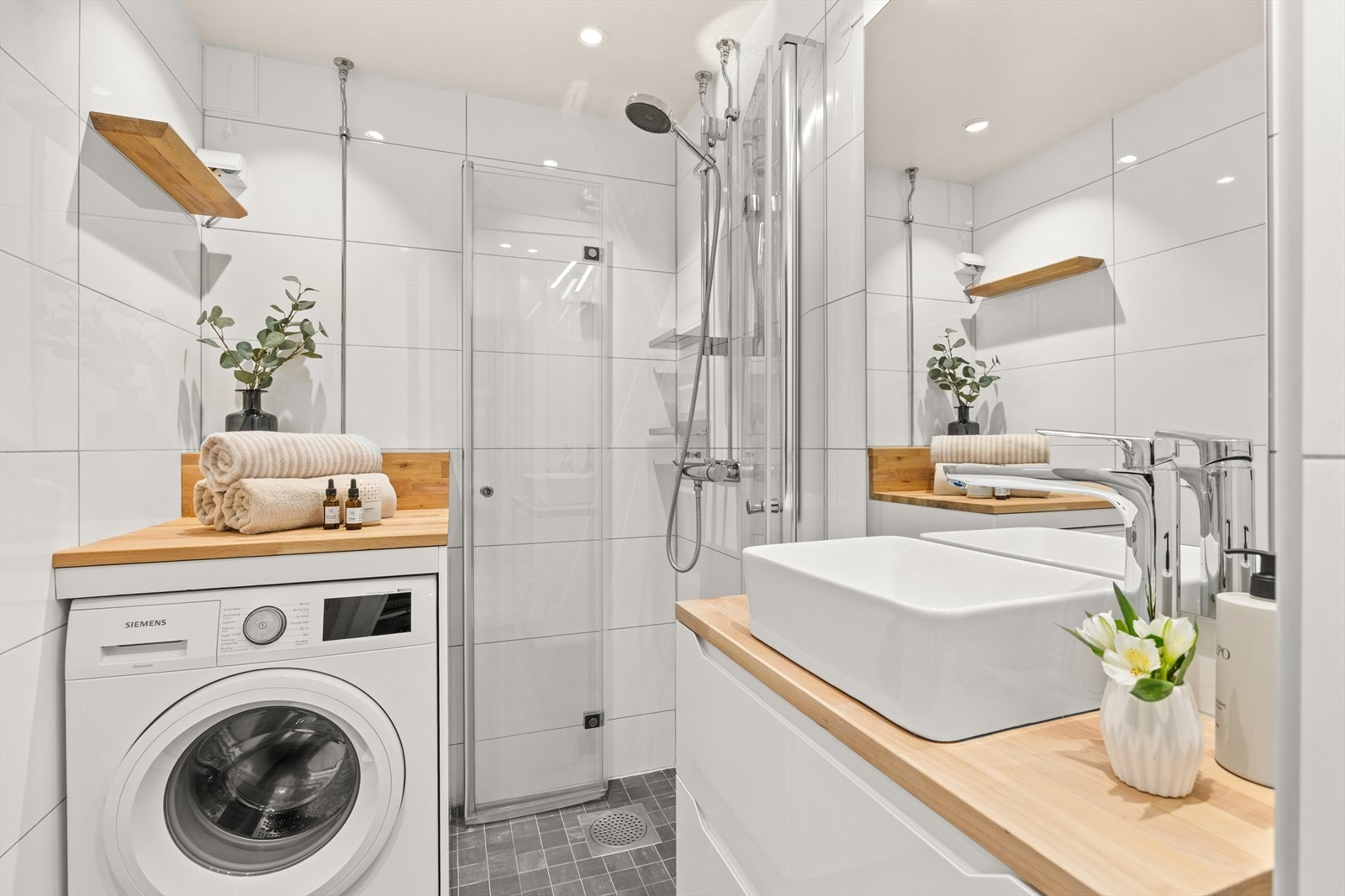 Delikat flislagt bad fra 2009 i regi av borettslaget Galleribilde