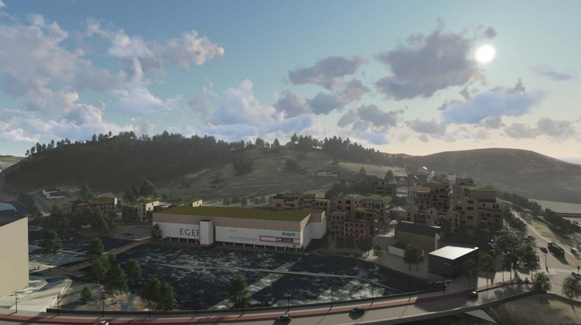 Illustrasonsbilde: Her ser en et større grøntområde og noen mindre bebyggelse bak Eger Stormarked. Det er her en nå ønsker å bygge skolen. Galleribilde