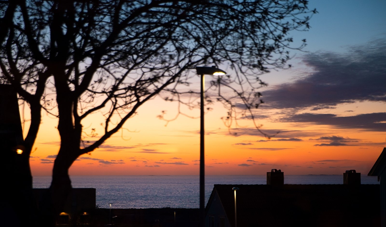 Solnedgang sett fra kjøkkenvindu Galleribilde