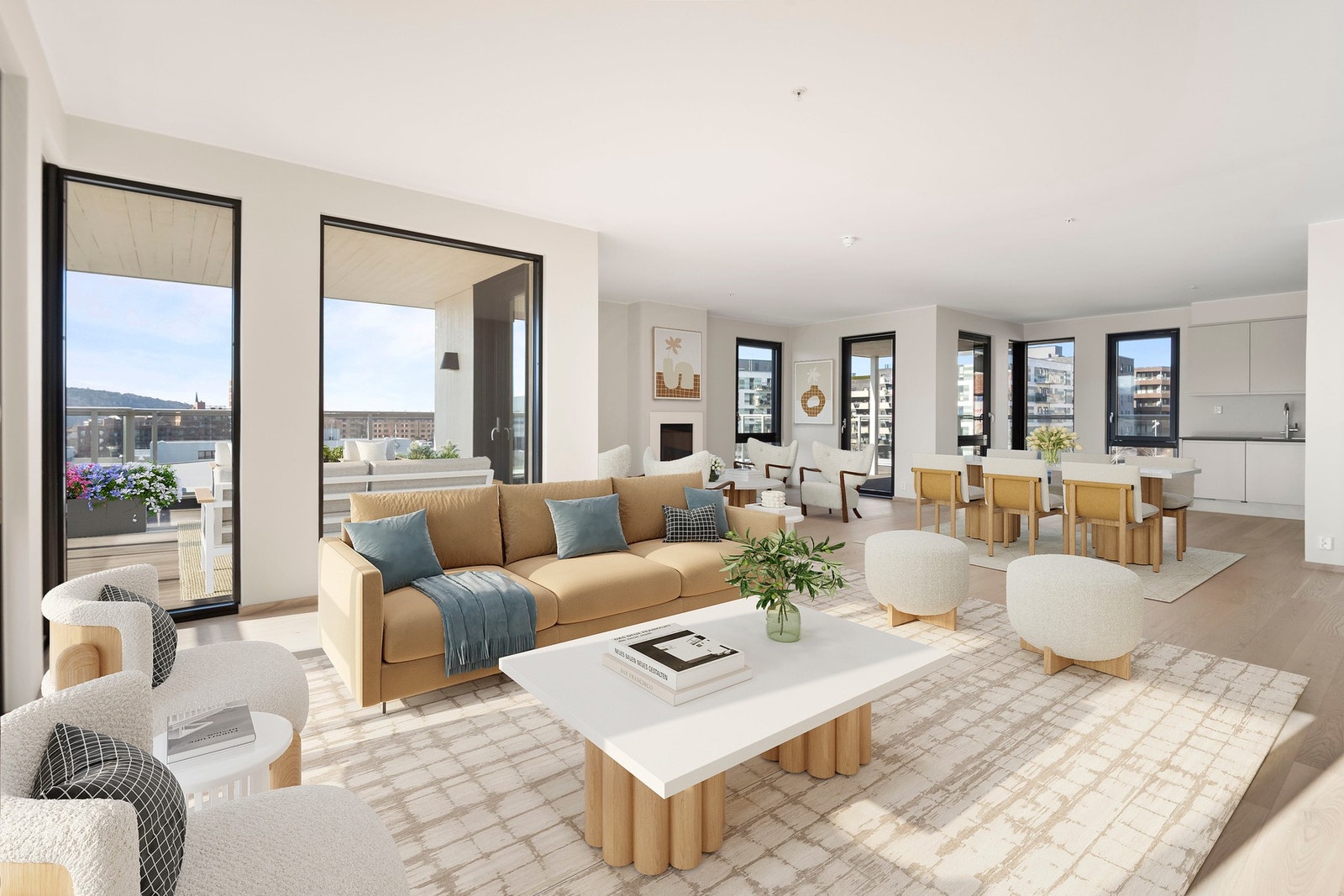 Stue og kjøkken er sømløst integrert i en åpen løsning som gir en luftig og sosial atmosfære. Galleribilde