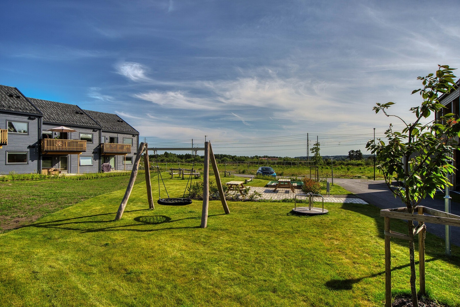 På fellesområdene til sameiet er det også noe for de minste. Her finner du husker, diverse lekeapparater og benker for de voksne Galleribilde