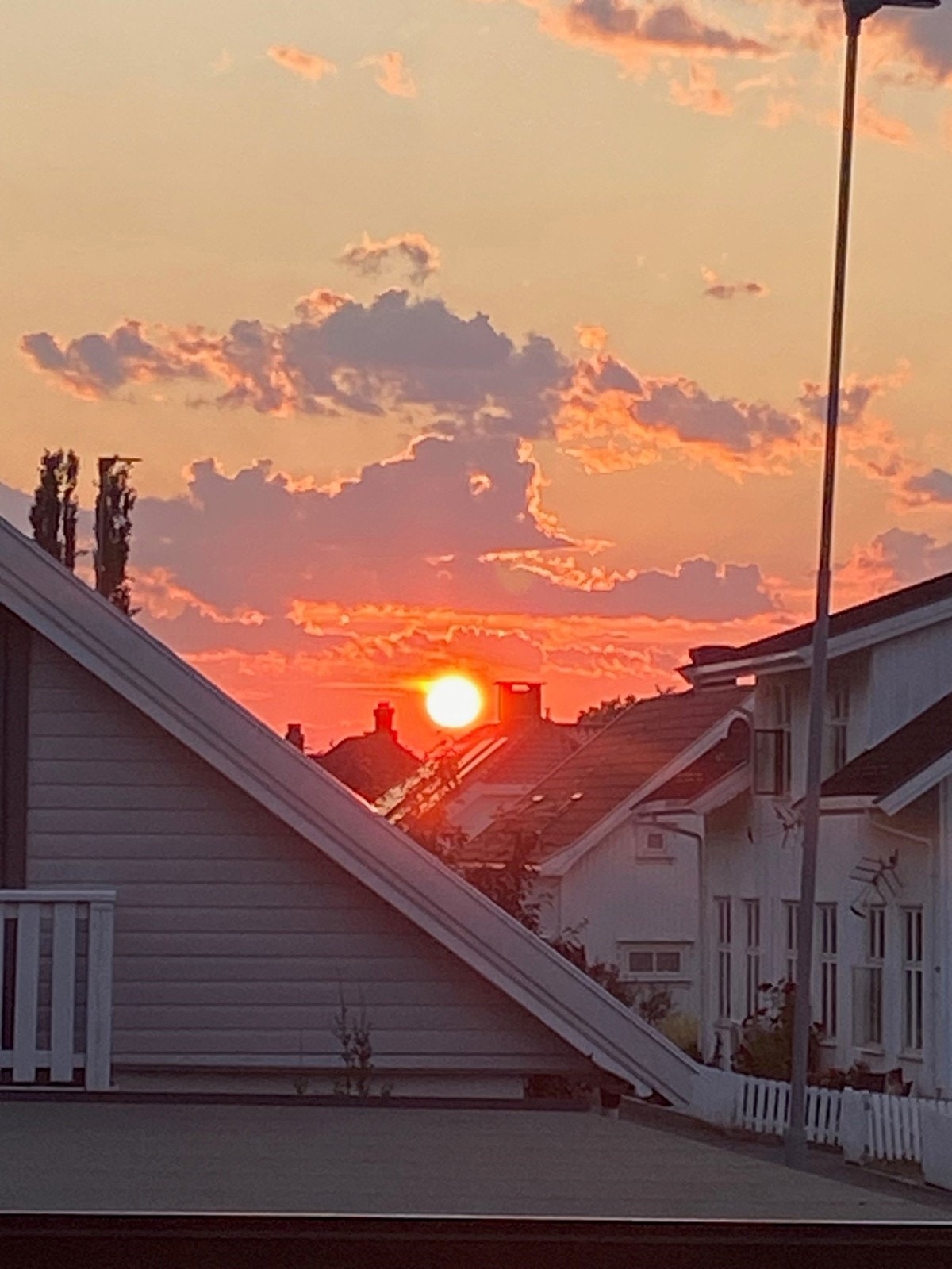 Solnedgang fra stuevinduet Galleribilde