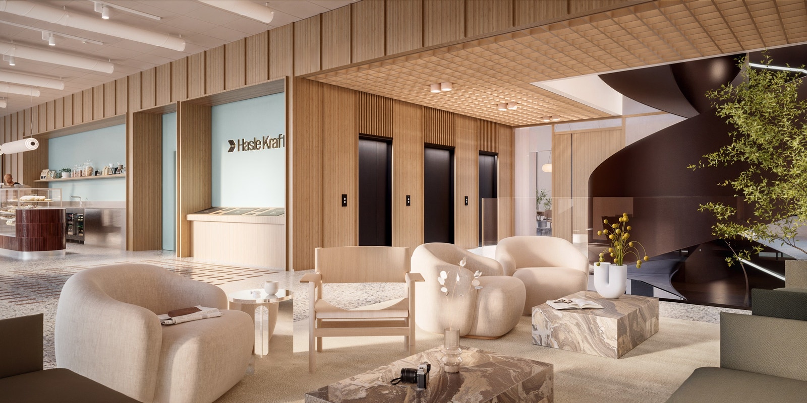 Byggets åpne trappeløsning knytter etasjene sammen på en sosial og aktiv måte Galleribilde