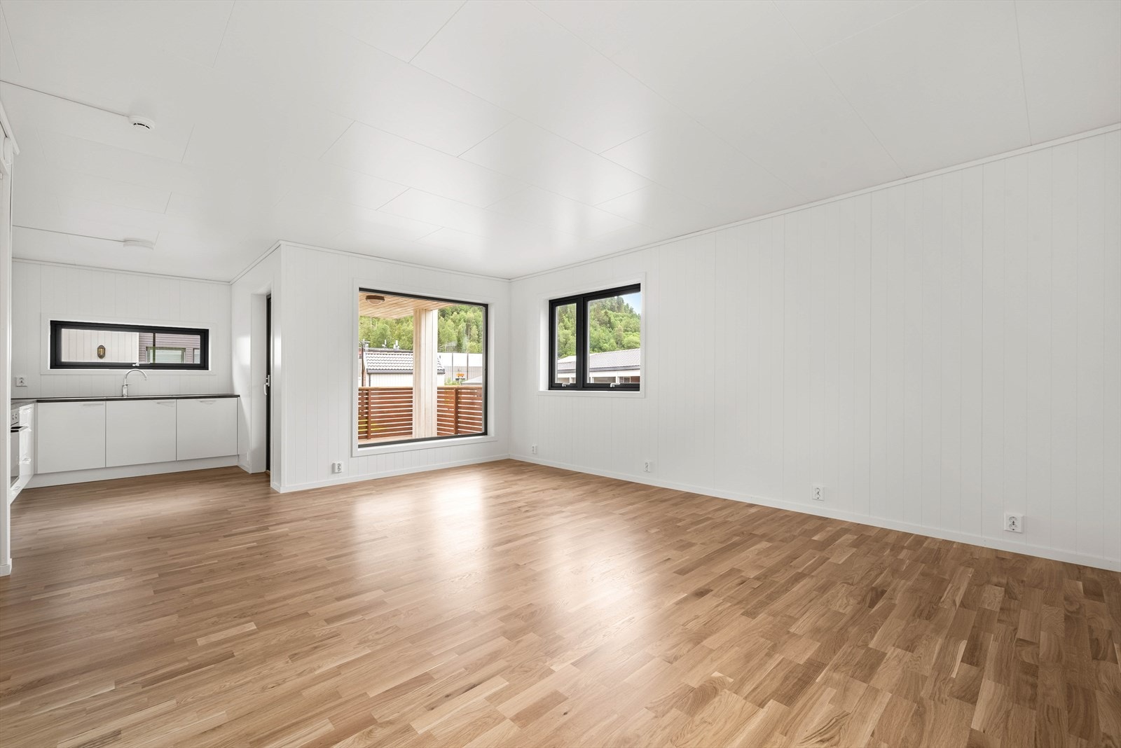 Utbygger har ordnet med komfortabel gulvvarme på stue og kjøkken. Galleribilde