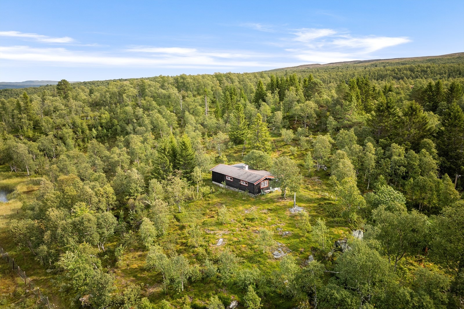 En trivelig og enkel hytte, med oppgraderingsbehov, beliggende i Rugldalen. Galleribilde