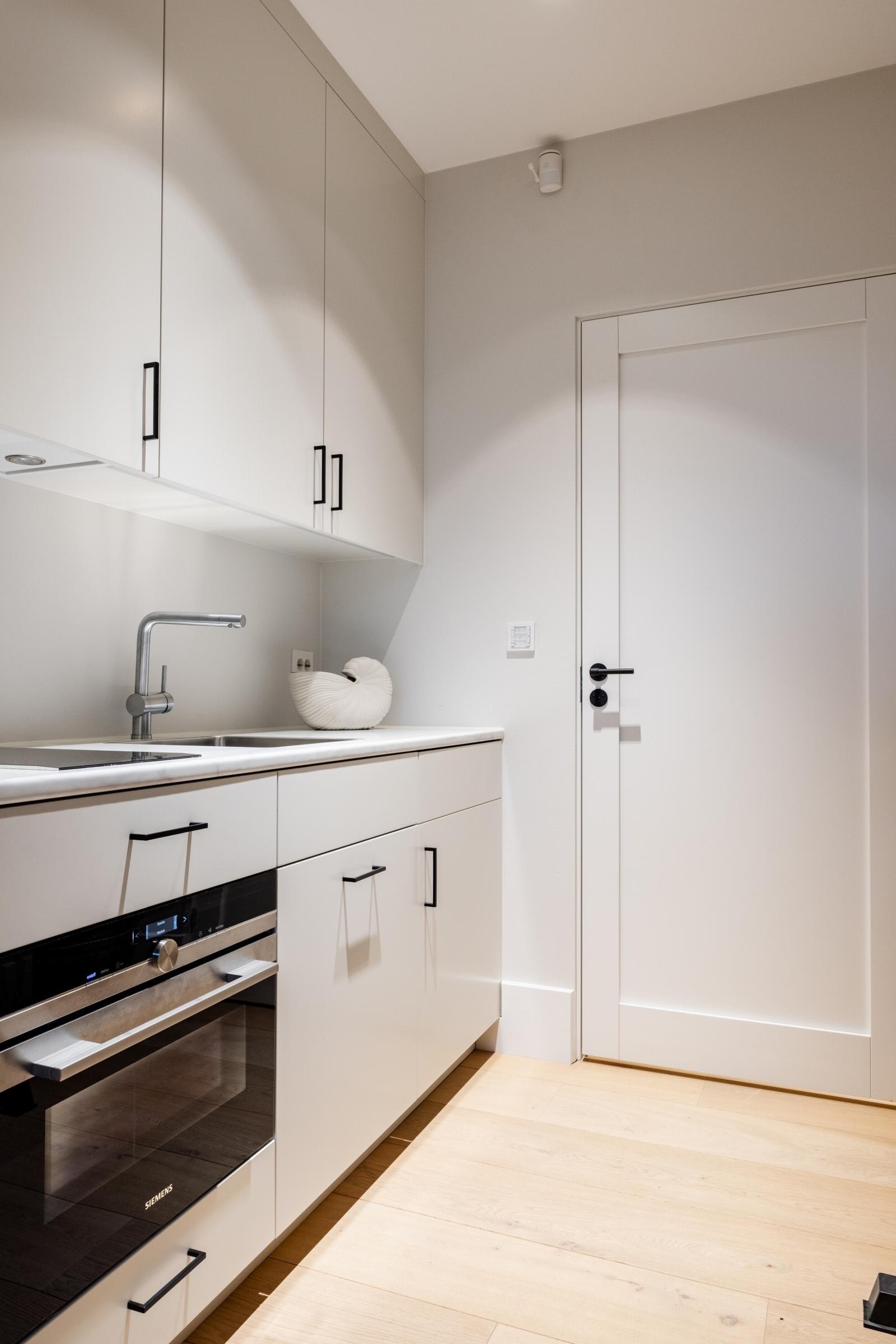 Kjøkken til soverom/treningsrom i underetasjen. Galleribilde