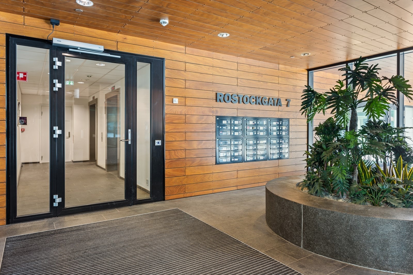 Representativt inngangsparti for beboere på toppen av bygget Galleribilde