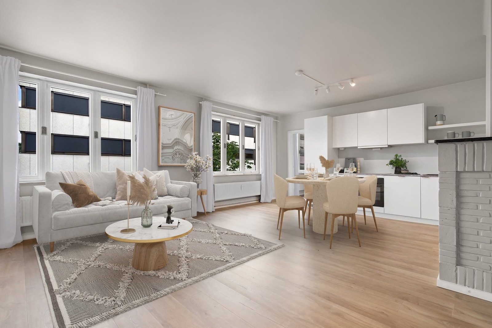 Kjøkken i åpen og sosial løsning mot stuen.
Bildet er digitalt stylet Galleribilde