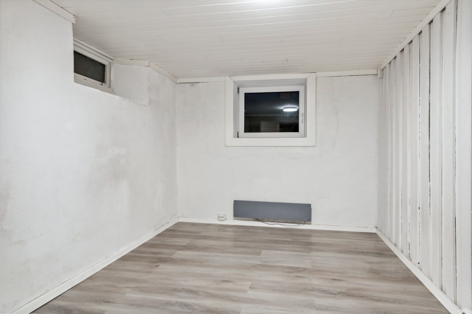 Rom i kjeller som er beskrevet som soverom Galleribilde