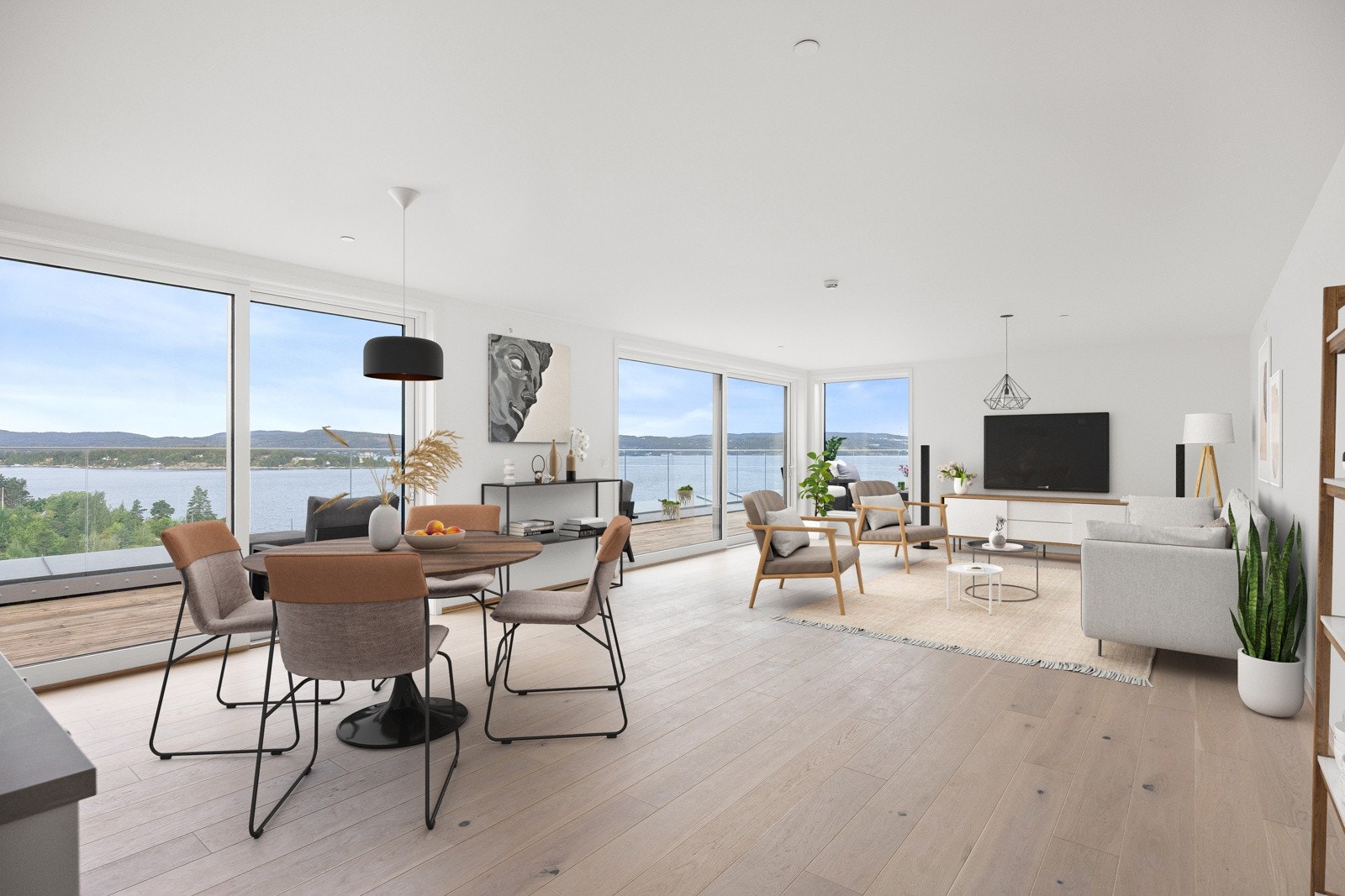 Romslig stue/kjøkken med store vindusflater gir god romfølelse. Galleribilde