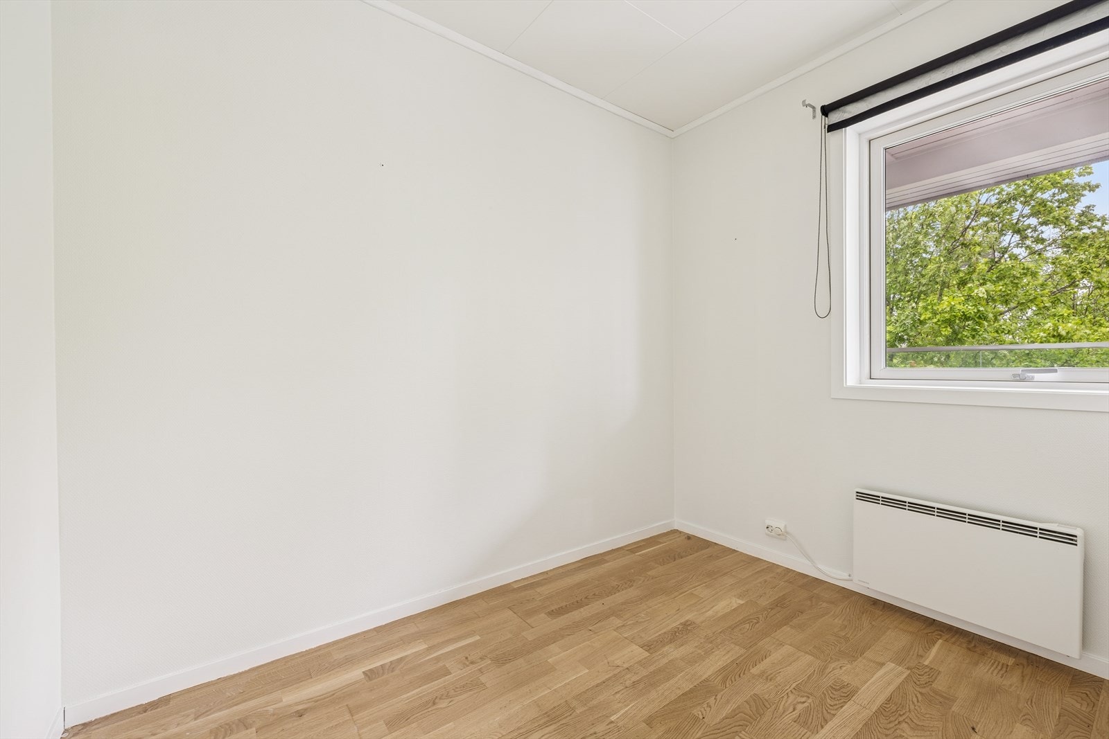 Soverom 1 er i lyse farger. Galleribilde