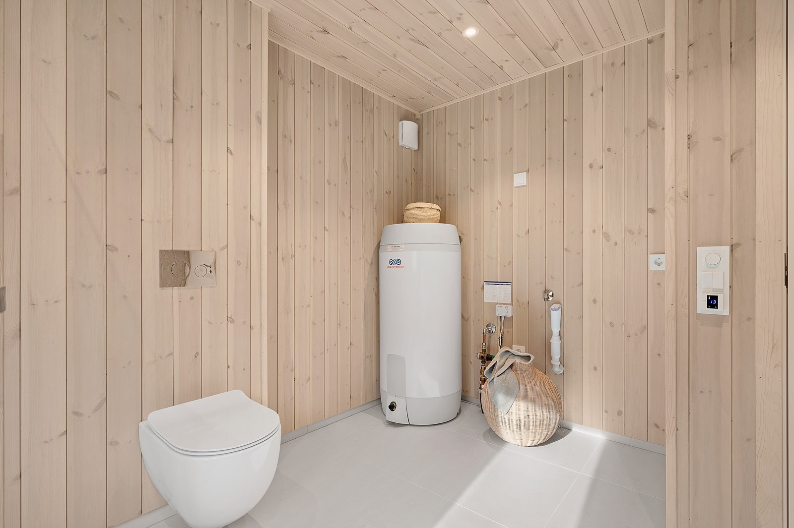 Del av badet, her med opplegg til vaskemaskin. Galleribilde