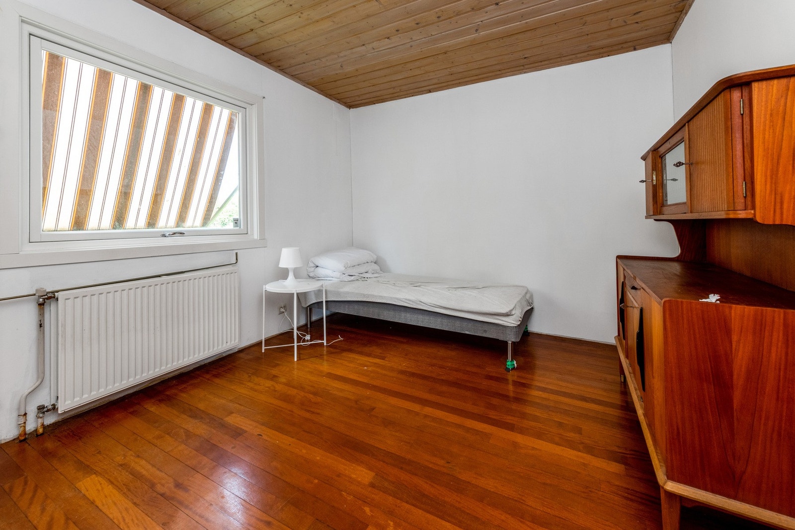 Del av stue innredet som soverom Galleribilde