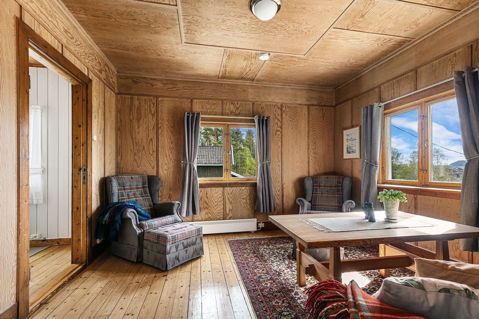 Et lunt oppholdsrom som egner seg godt for både avslapning og samvær. Galleribilde