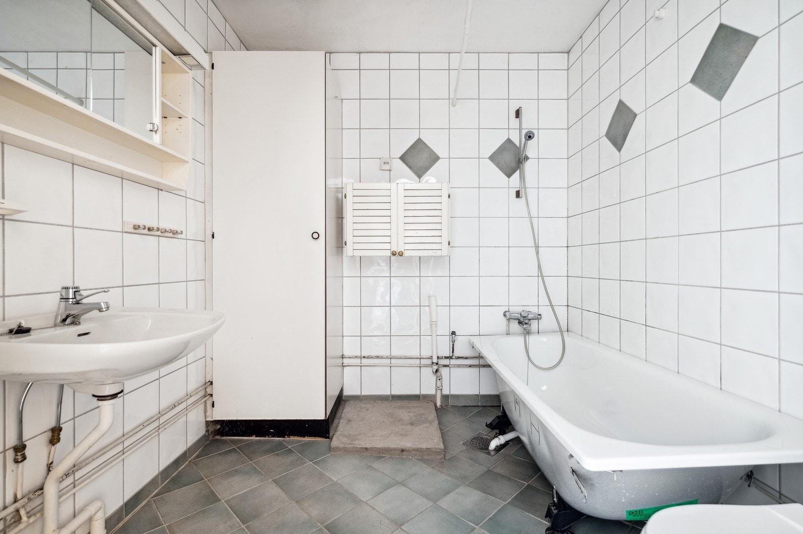 Badet har opplegg til vaskemaskin. Galleribilde