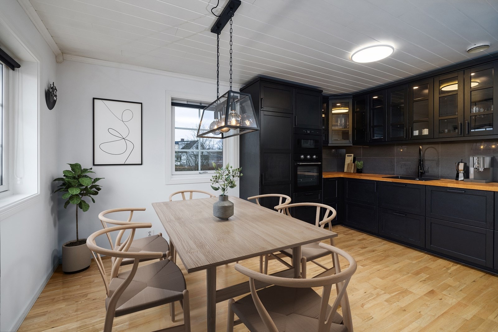 Det er også plass til et spisebord praktisk plassert nær kjøkkenet. (Bildet er digitalt stylet) Galleribilde