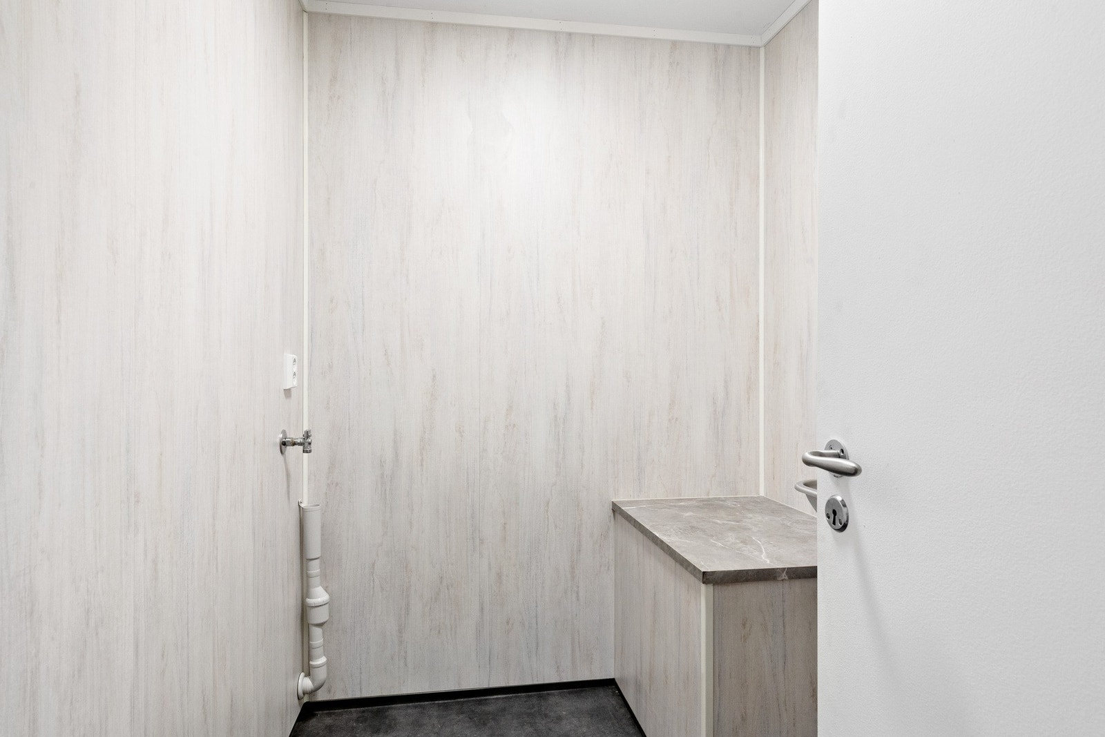 Boligen har også en eget vaskerom. Galleribilde