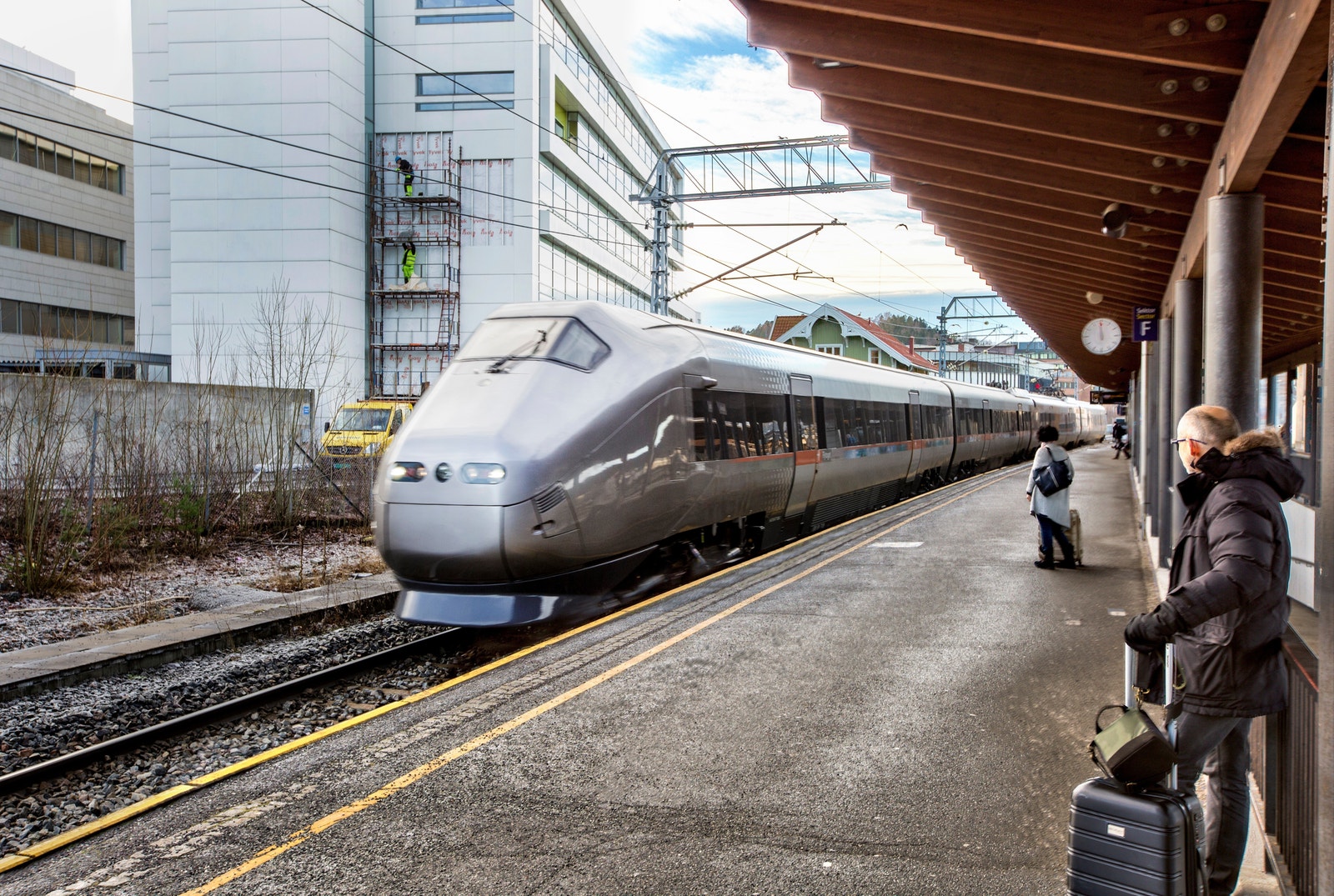 Buss og tog - rett ved siden av bygget. Galleribilde