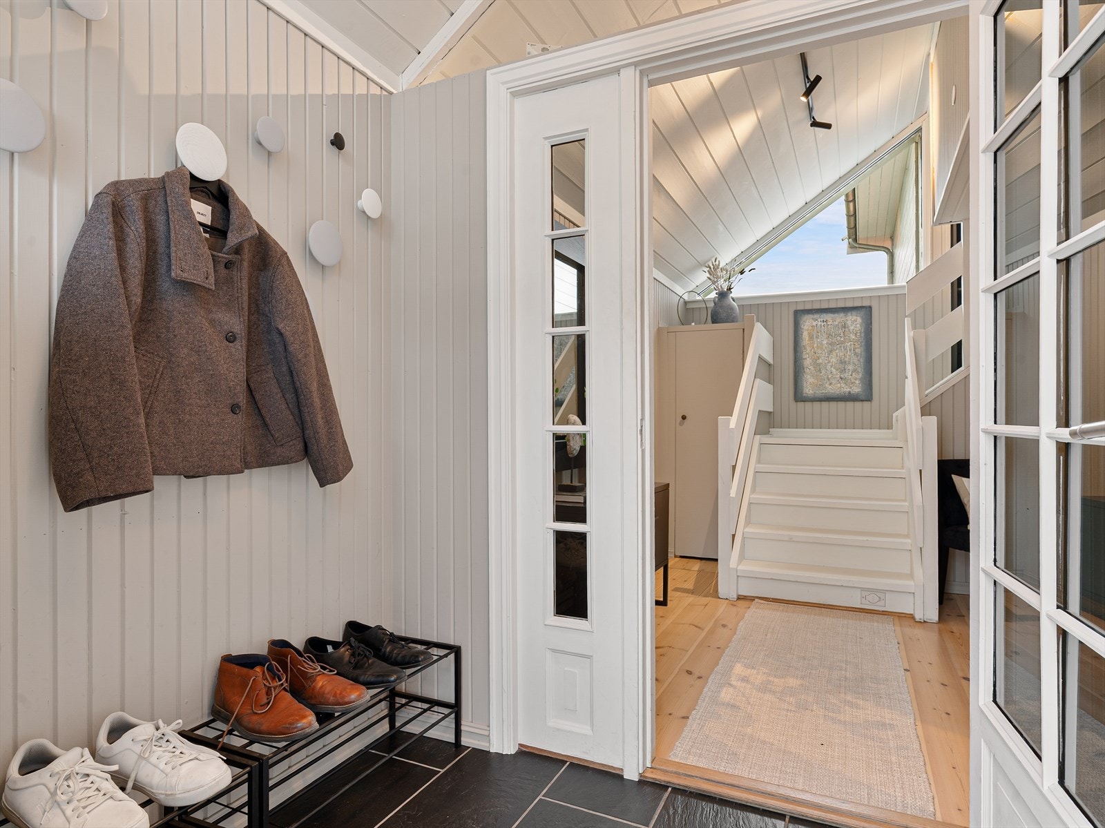 Både vindfang og gang er bygget på det opprinnelige huset. Galleribilde