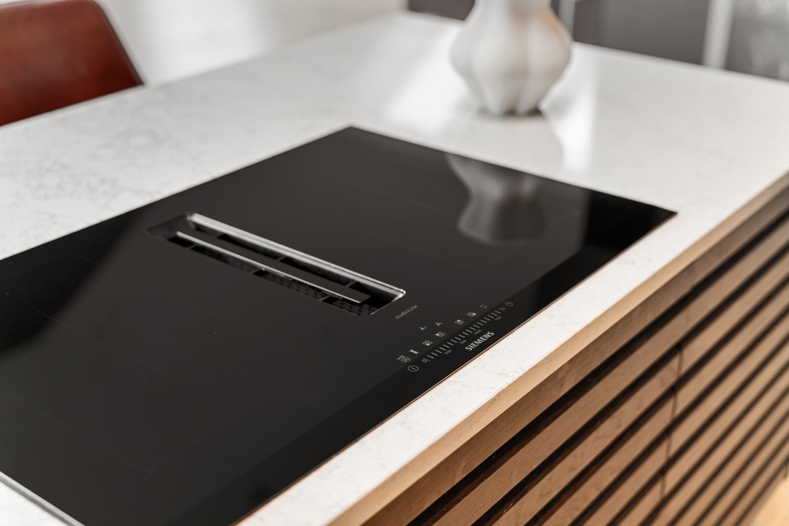 Kullfilterventilator integrert i platetopp Galleribilde