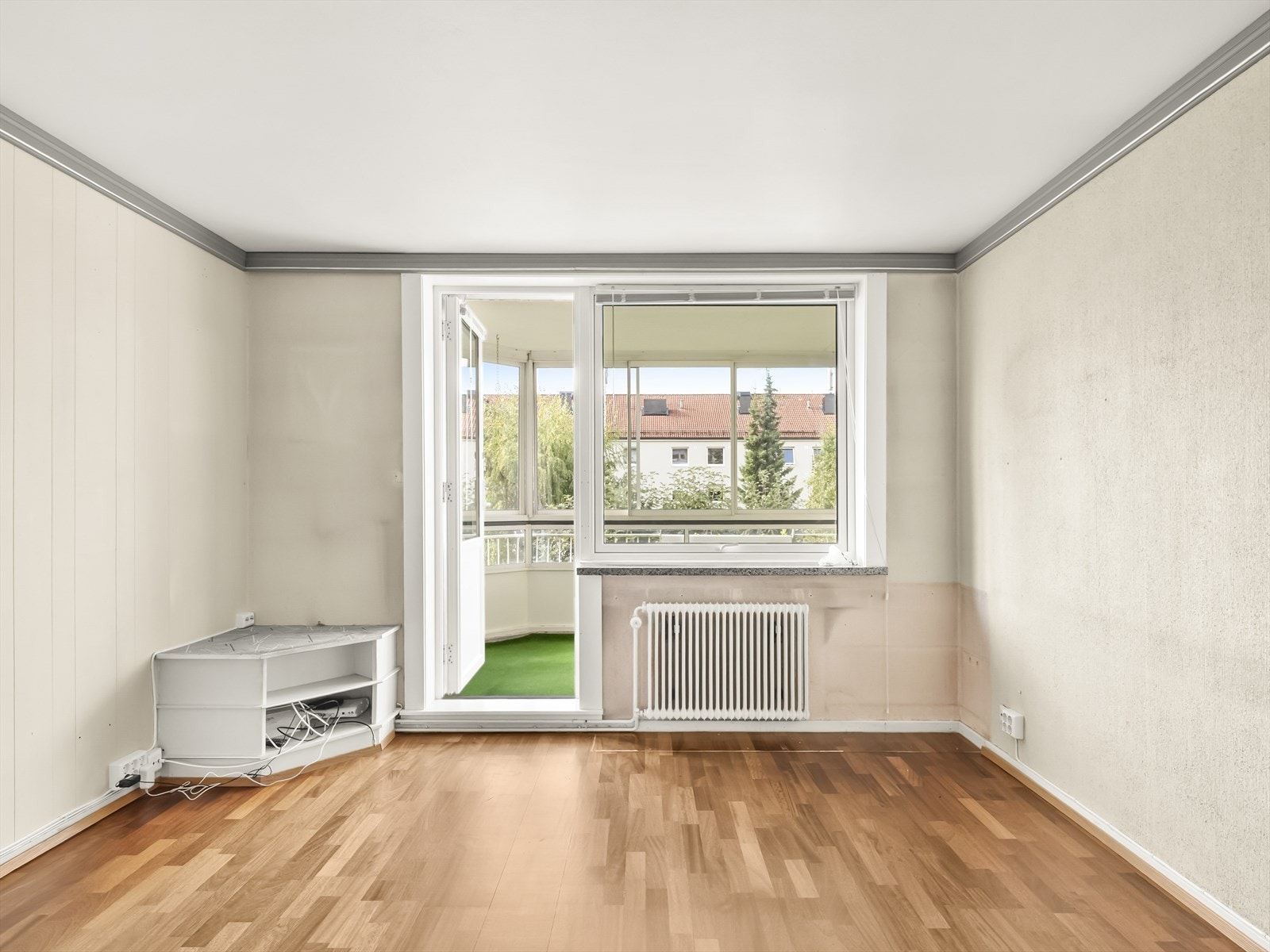 Direkte utgang fra stuen til en herlig, innglasset balkong. Galleribilde