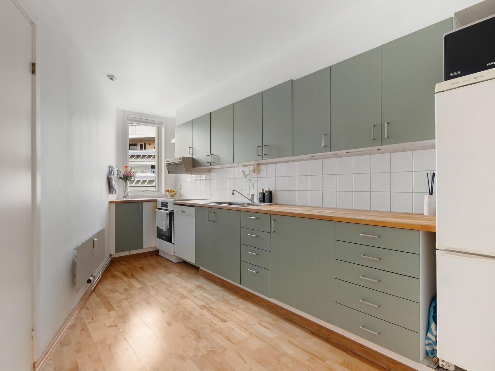 Kjøkkenet fremstår som en invitasjon til kokkekunst på sitt beste. Galleribilde