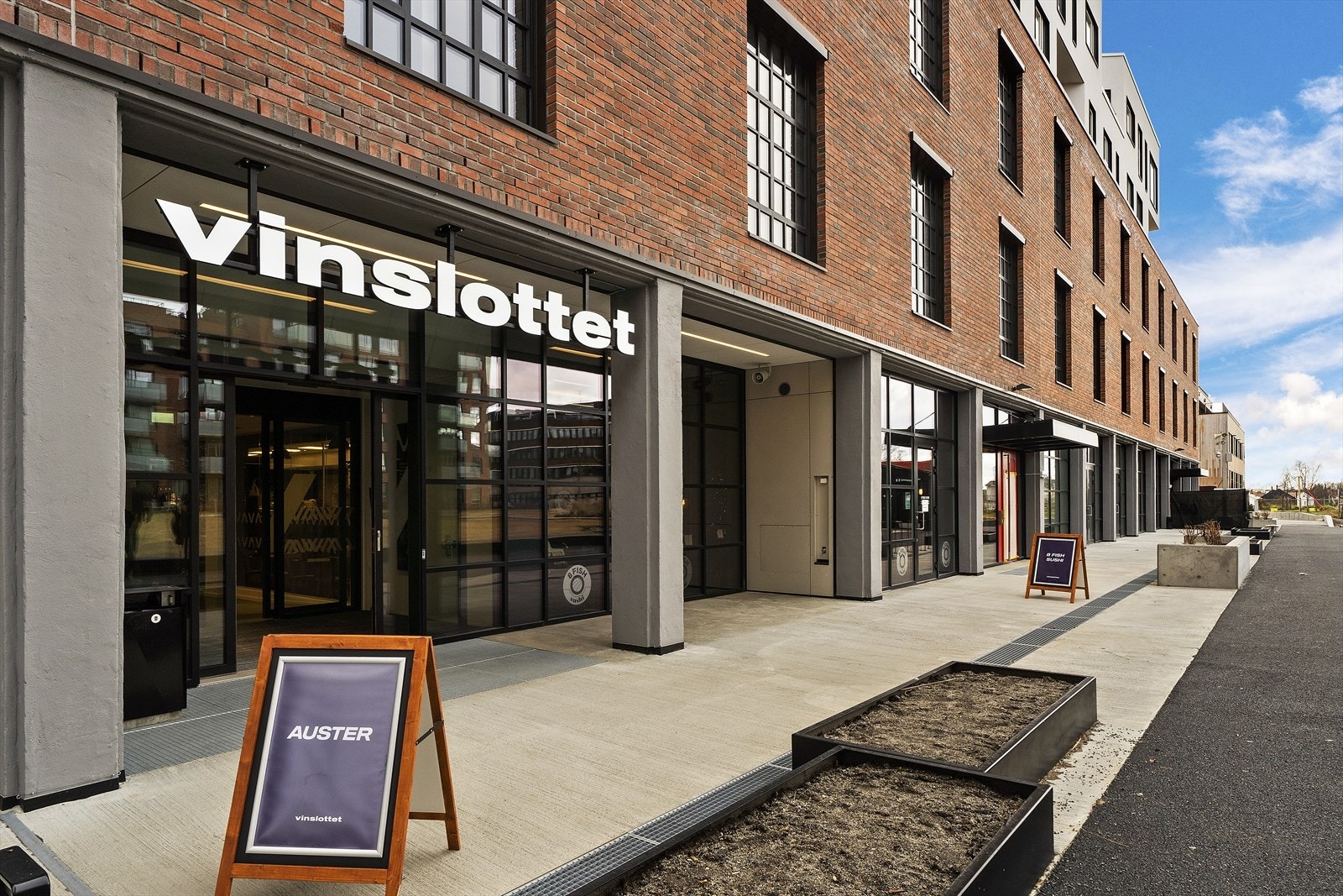 På Vinslottet på Hasle finner du bl.a. en gastropub, Spar, frisør m.m. Galleribilde