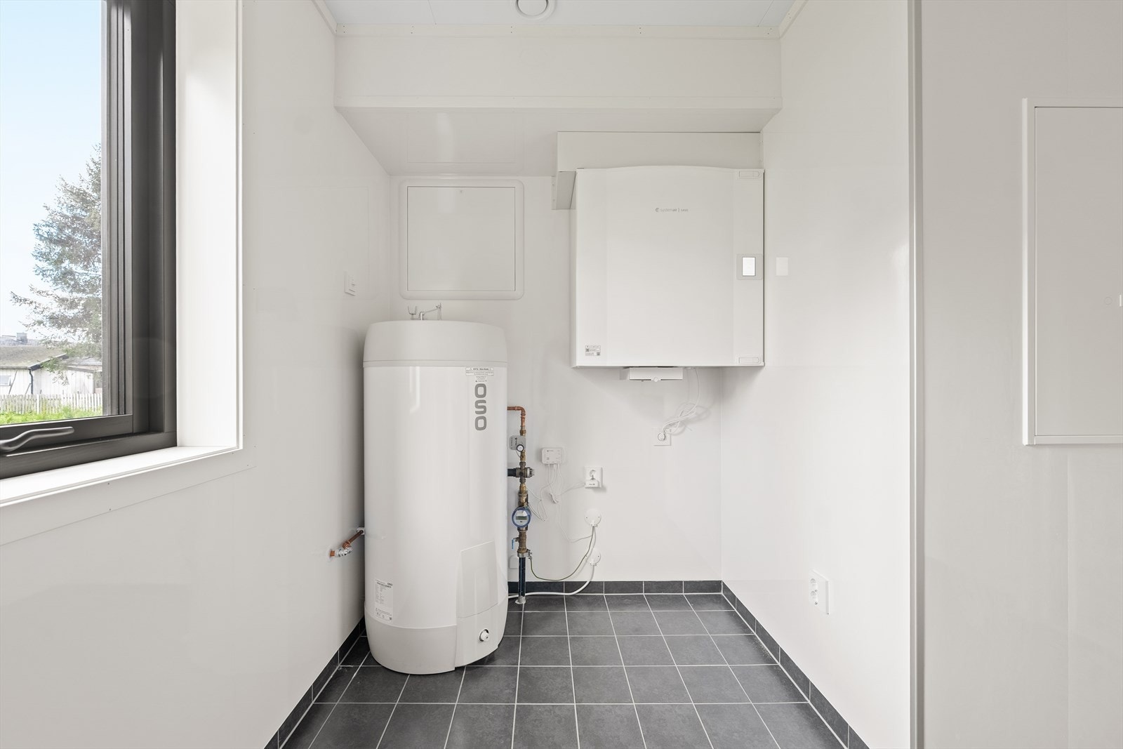 På vaskerommet er også varmtvannstanken plassert. Galleribilde