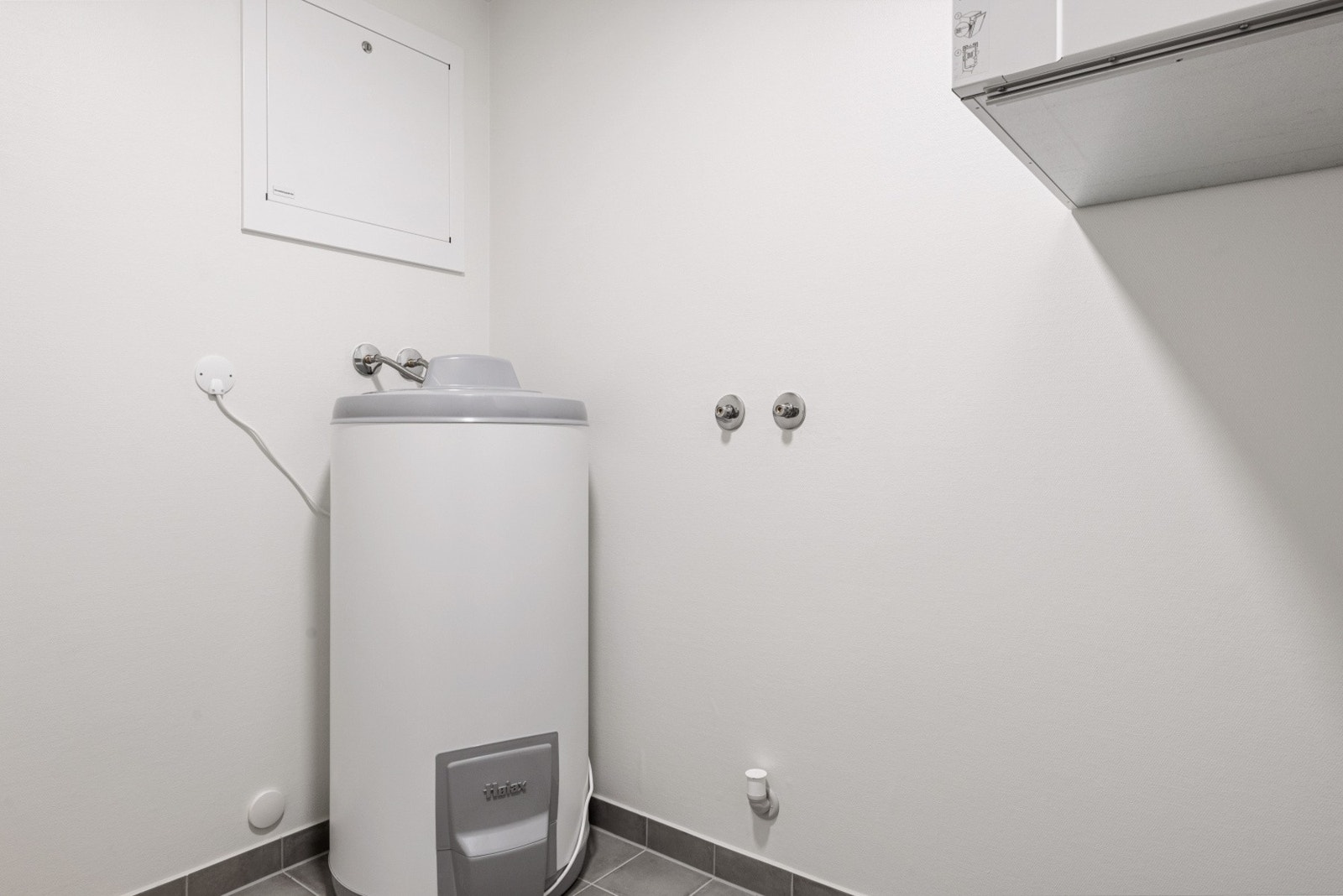 God plass til vaskemasking og tørketrommel. Galleribilde