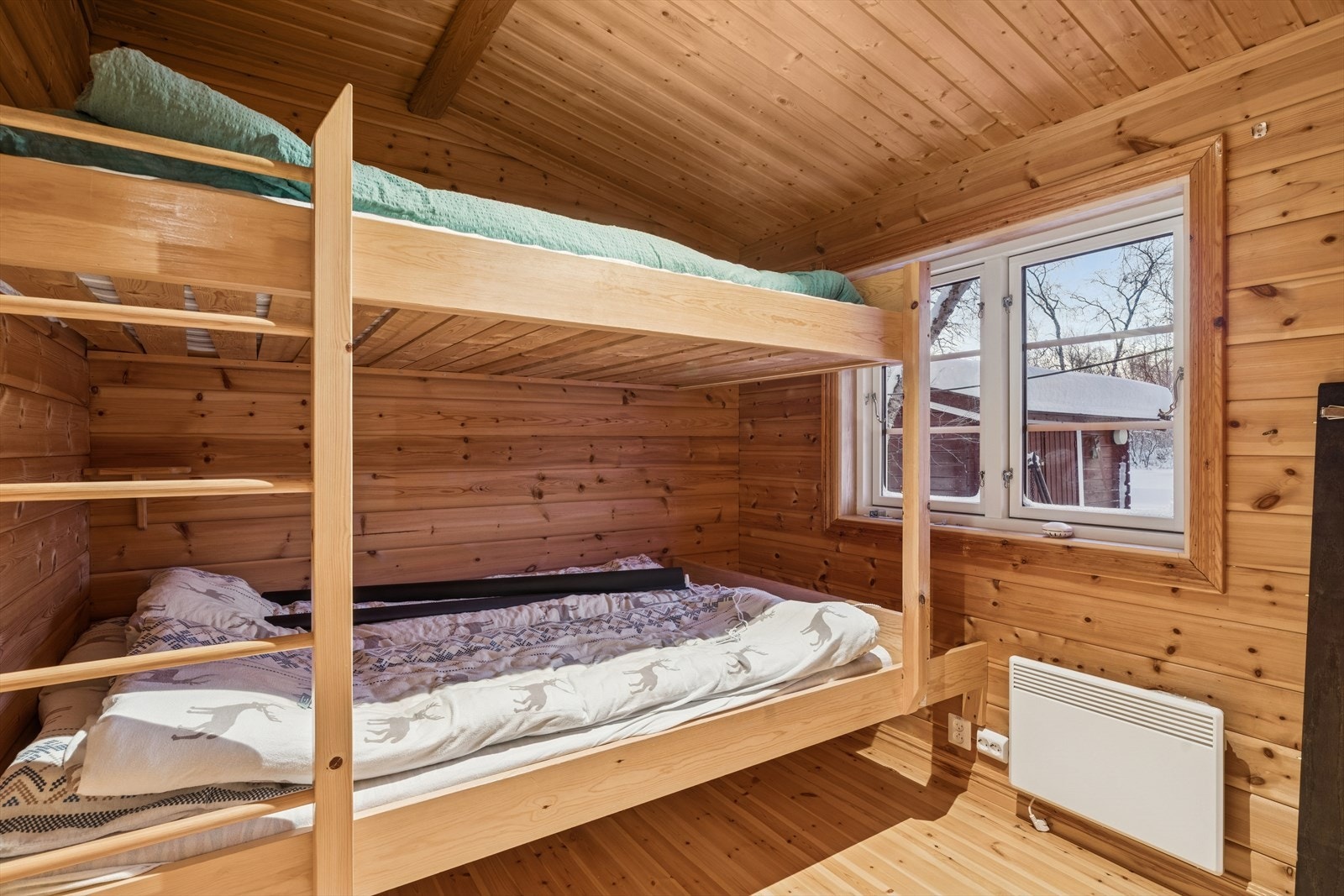 Ett av soverommene er innredet med køyeseng og gir plass til flere overnattingsgjester. Galleribilde