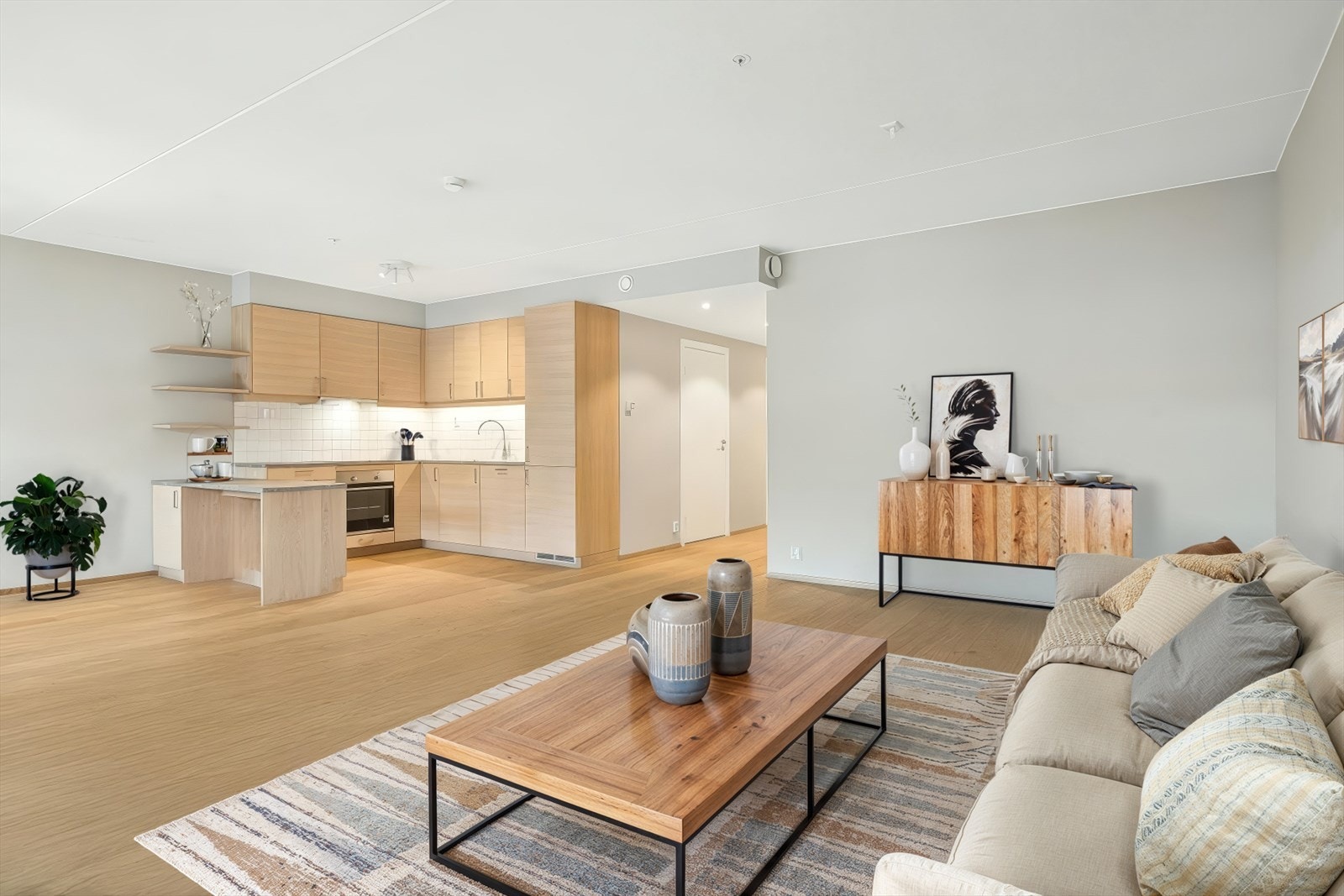 Stuen har åpen løsning mot kjøkken. Bildet er digitalt stylet. Galleribilde