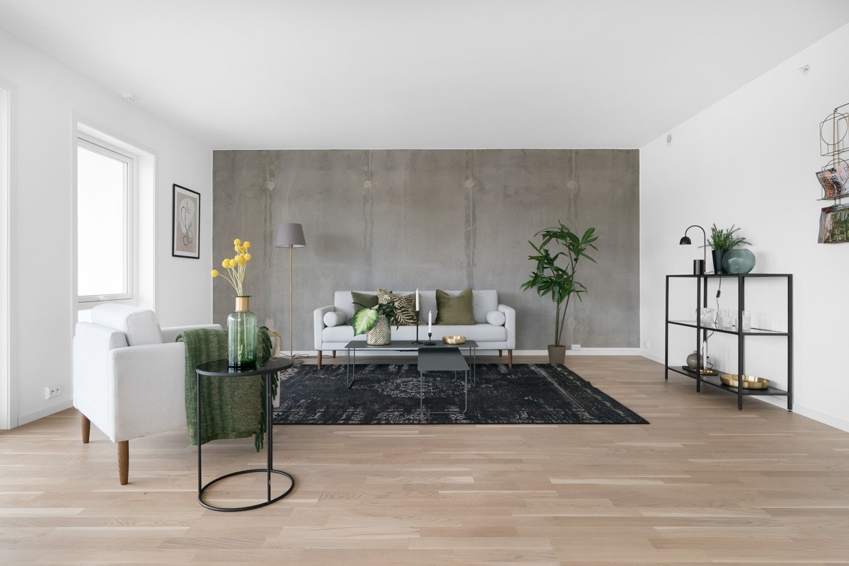 Stuen har en moderne kontrastvegg i betong Galleribilde