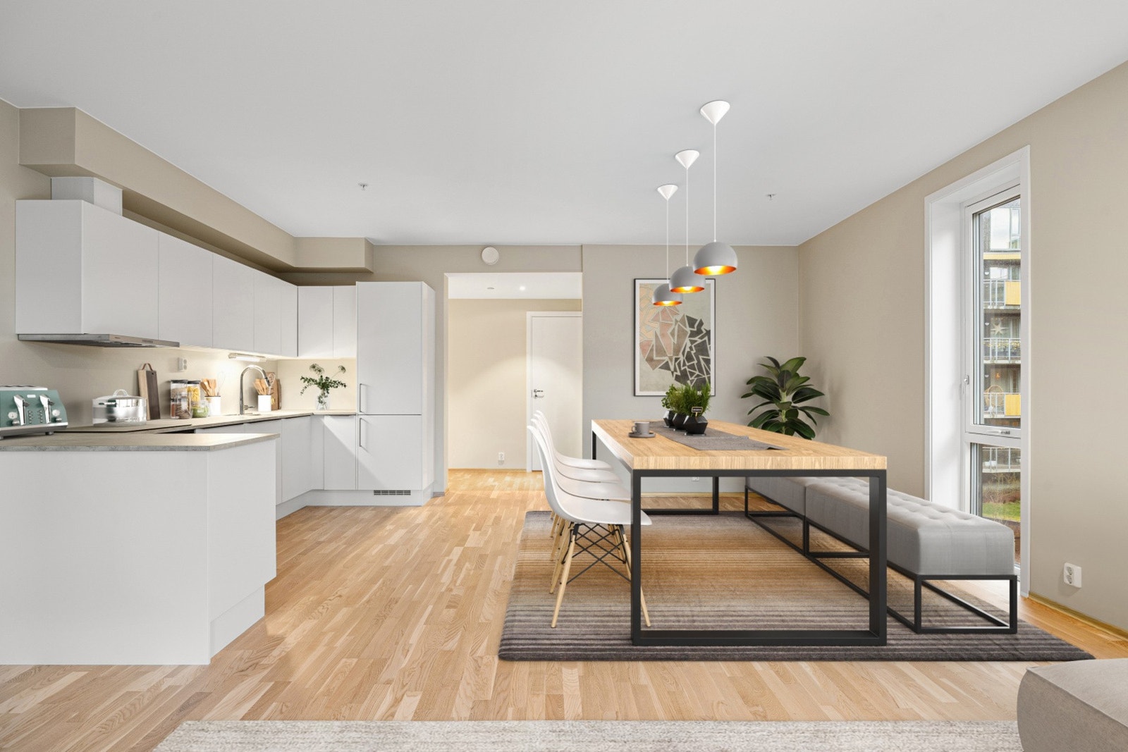 Kjøkken med hvite og glatte kjøkkenfronter. Galleribilde