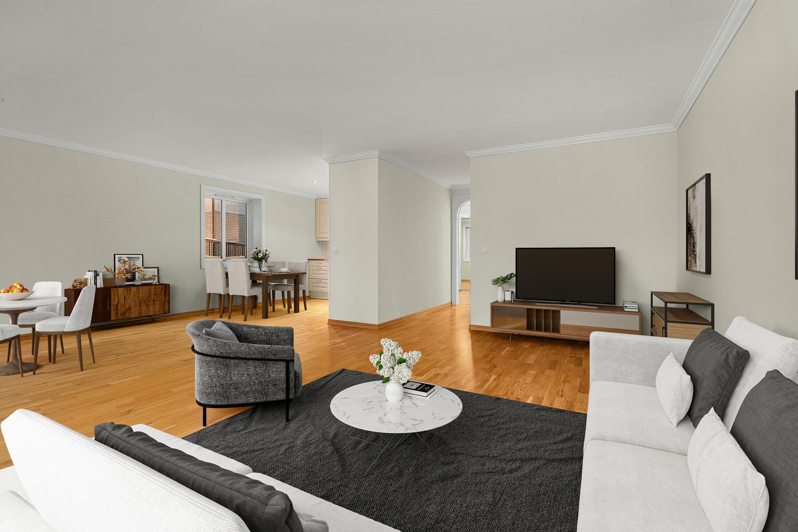 Lys og romslig stue med åpen løsning mot kjøkken Galleribilde