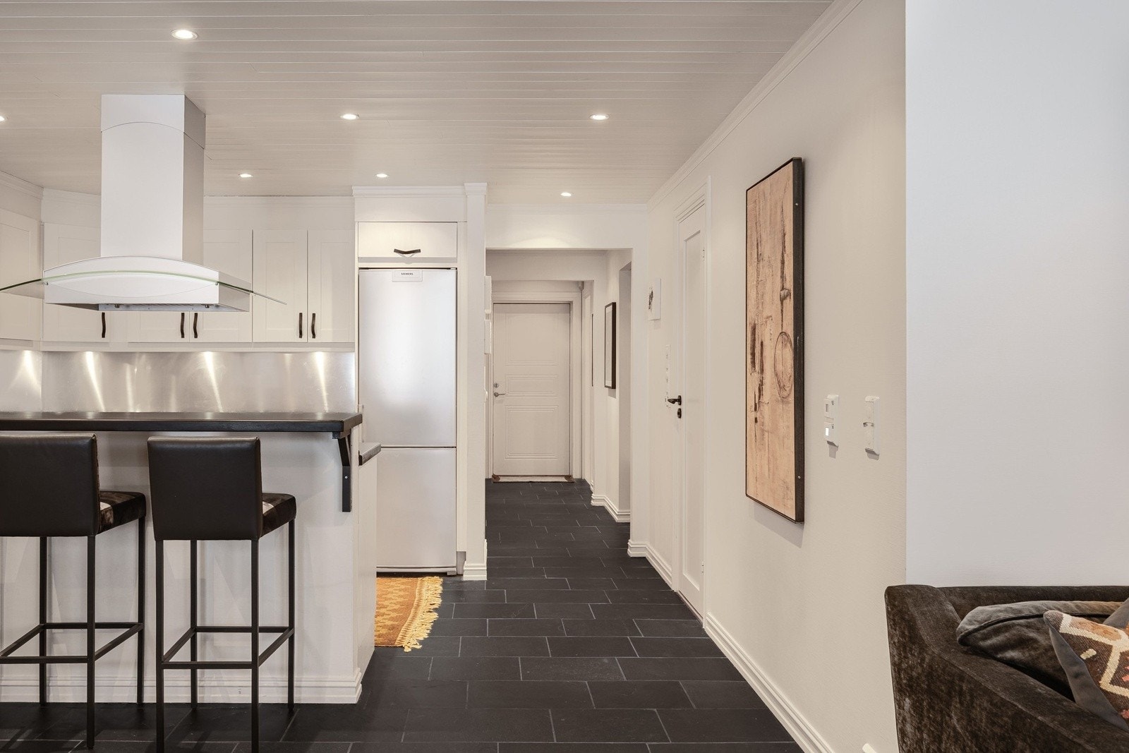 Praktisk utforming som legger til rette for både matlaging og sosialt samvær. Galleribilde