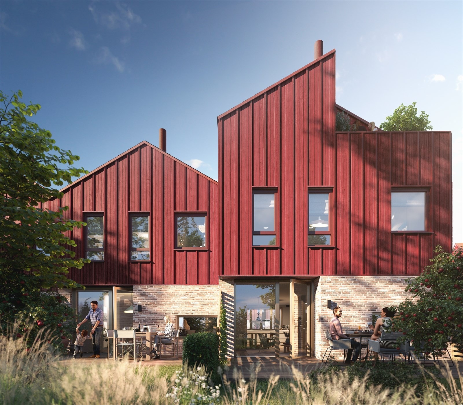 Boligene har fått innslag av materialer hentet fra den gamle låven. Teglstenen i første etasje og det stående panelet med dyp rødfarge supplementerer de historiske byggene rundt. Galleribilde