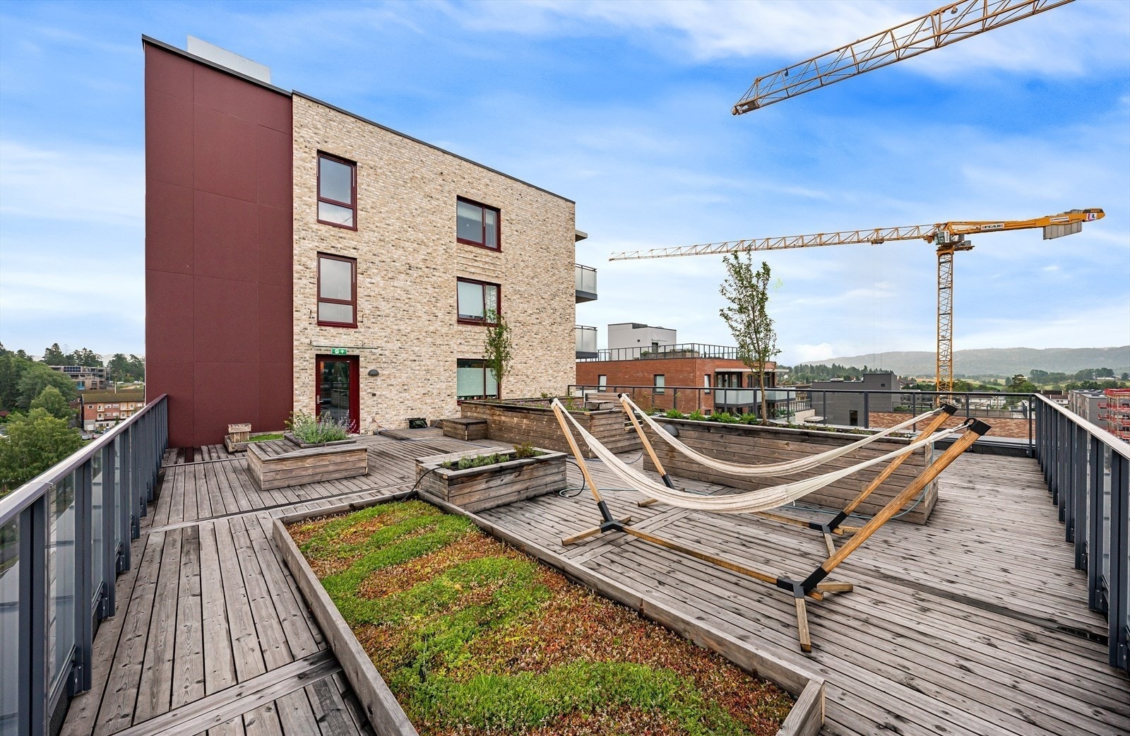 Beboerne har tilgang til en felles takterrasse, perfekt for lange sommerdager. Galleribilde