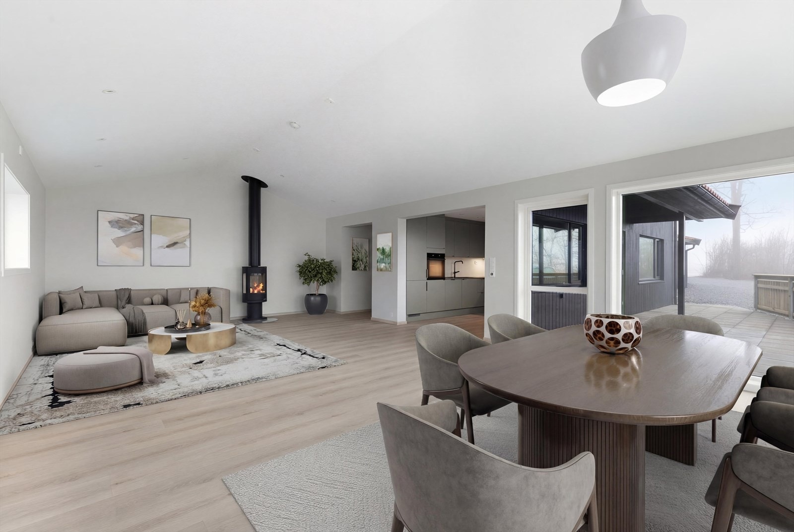 Romslig stue med peisovn. Praktisk planløsning. Lekker kjøkkeninnredning med integrerte hvitevarer. Galleribilde
