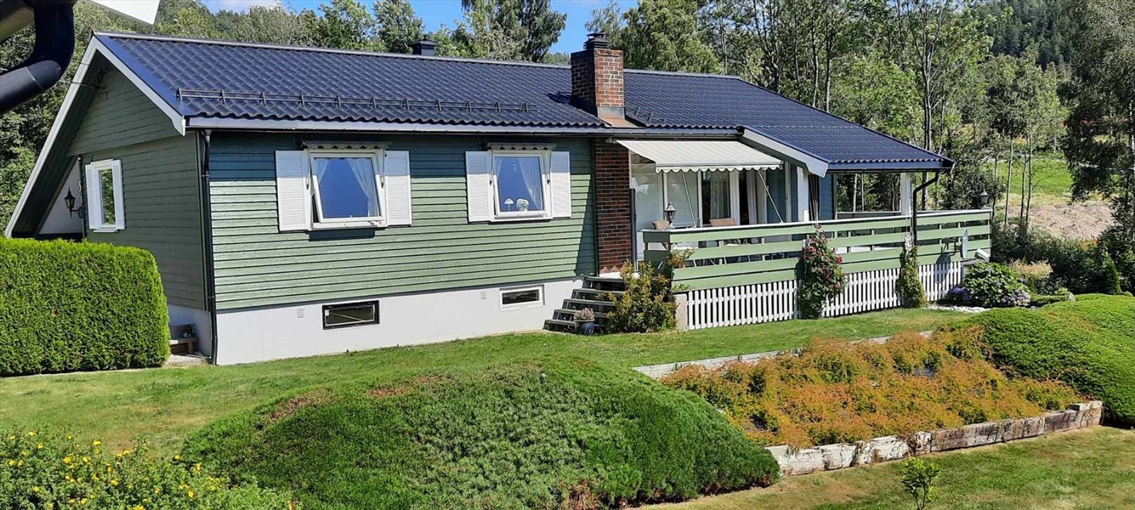 Selgers private bilder av huset på sommerstid Galleribilde