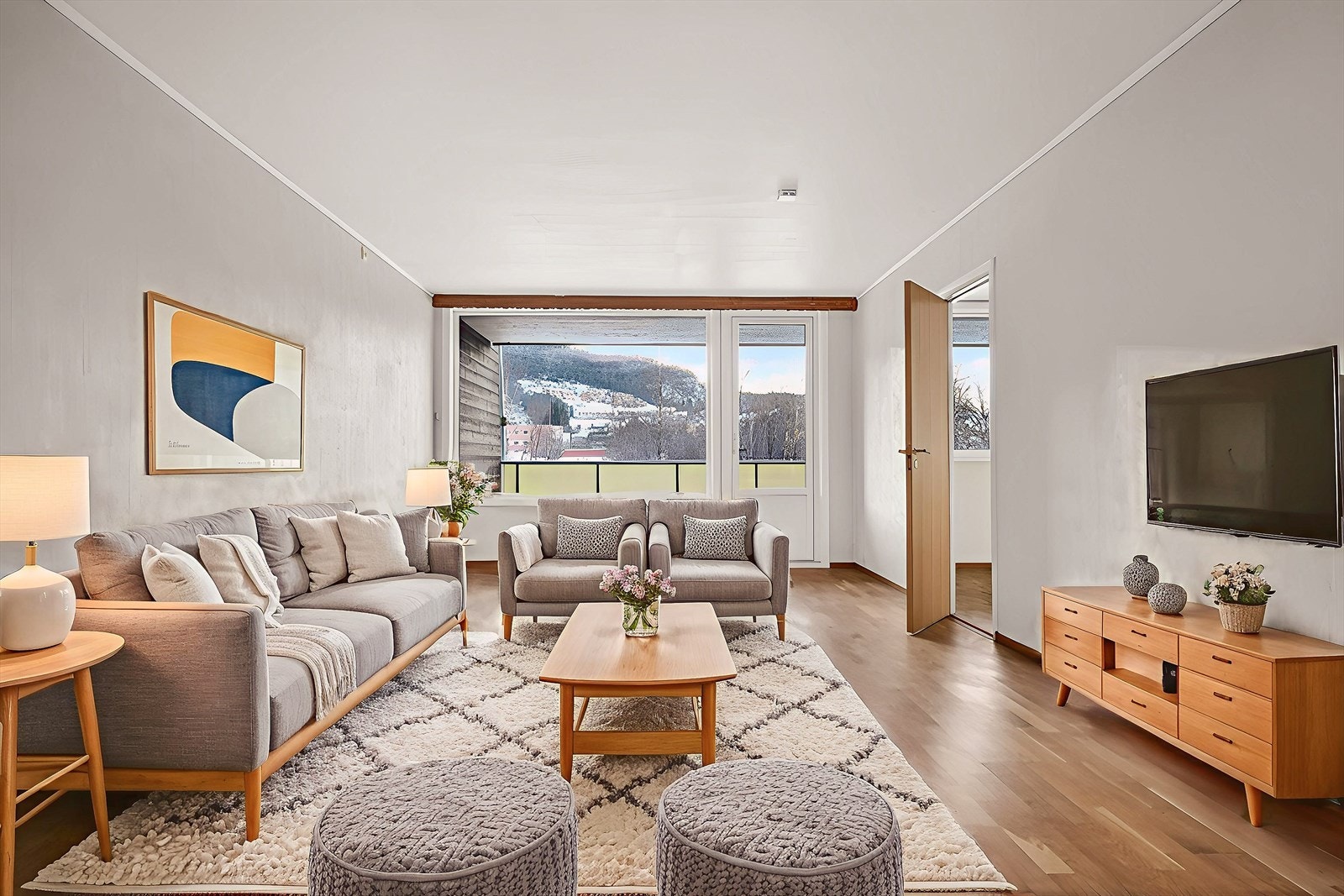 Digitalt møblert bilde av stuen i leiligheten. Galleribilde