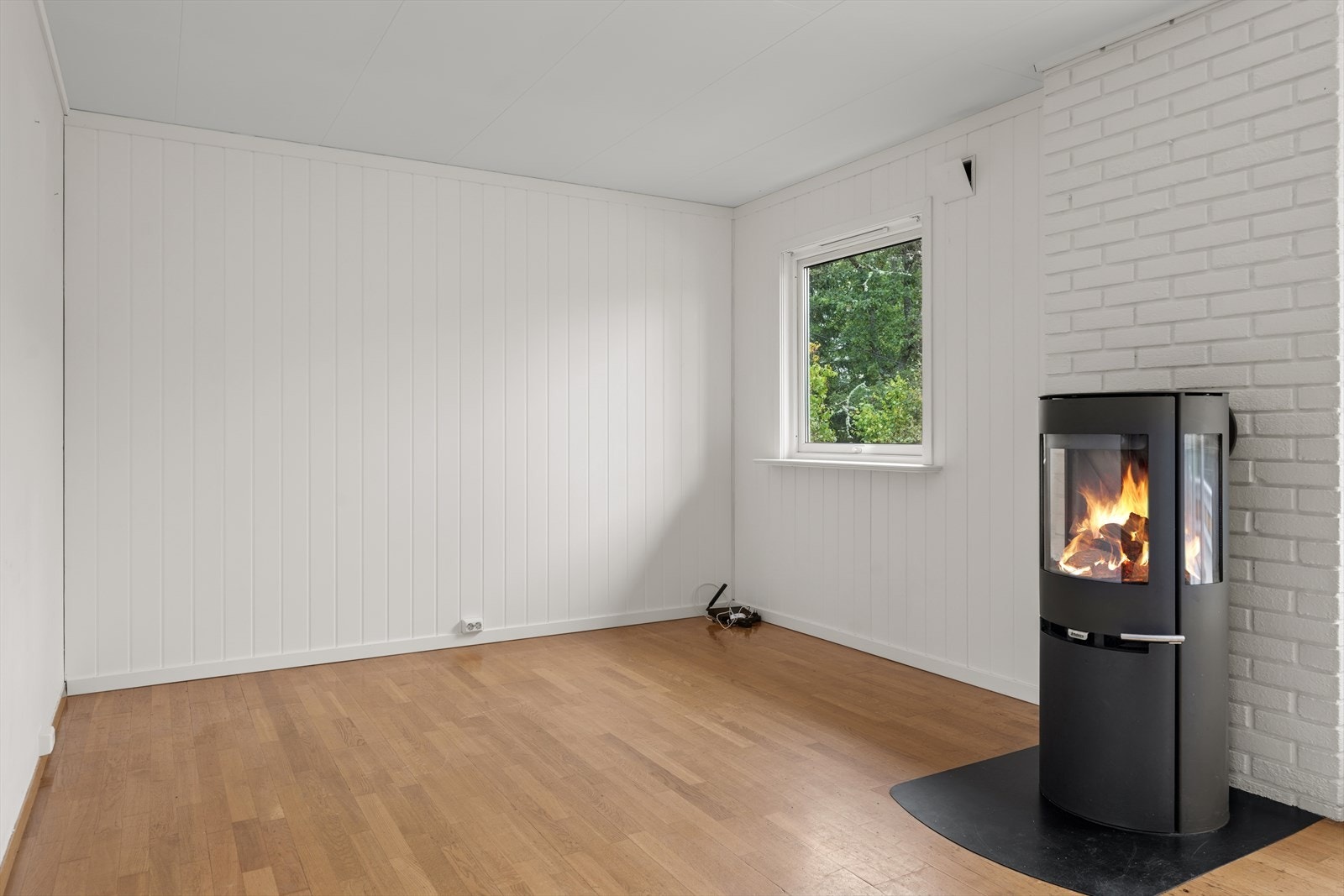 Vedovn gir varme og en lun atmosfære. Galleribilde