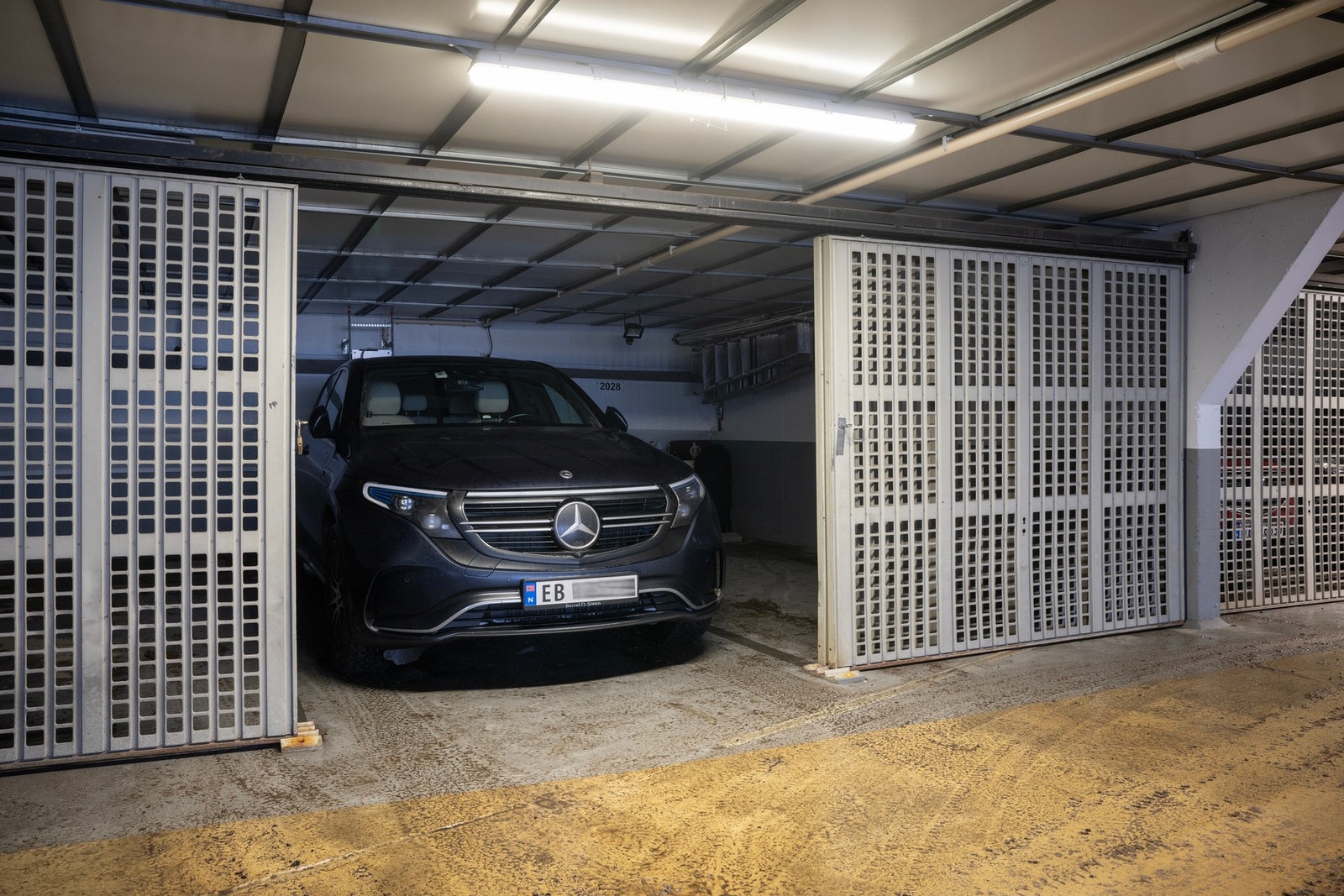 Det medfølger garasjeplass under bygget, tilrettelagt med elbillader. Galleribilde